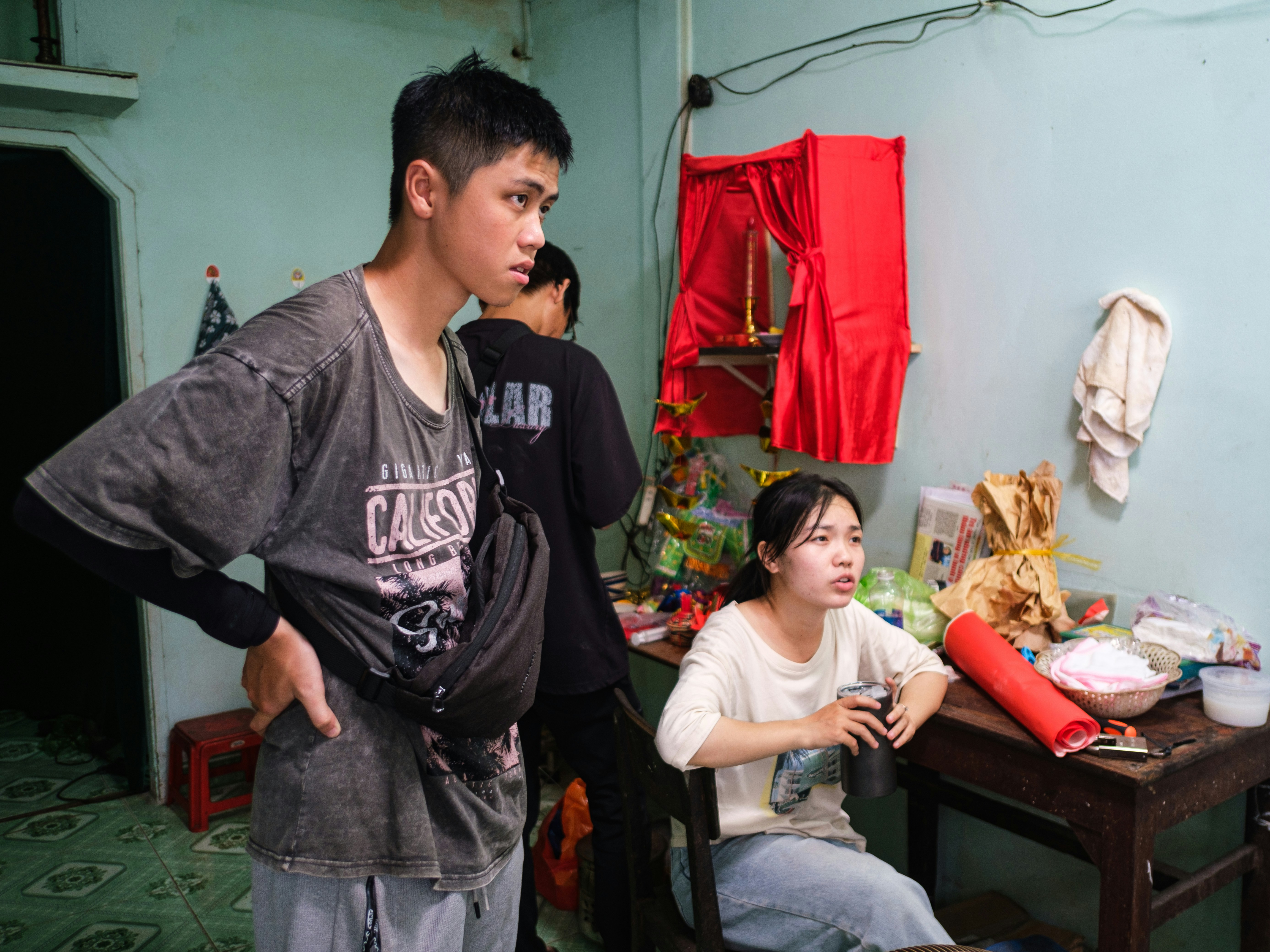 sibling supporting brother during difficult conversation at home