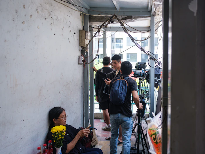 Film crew recording a documentary interview