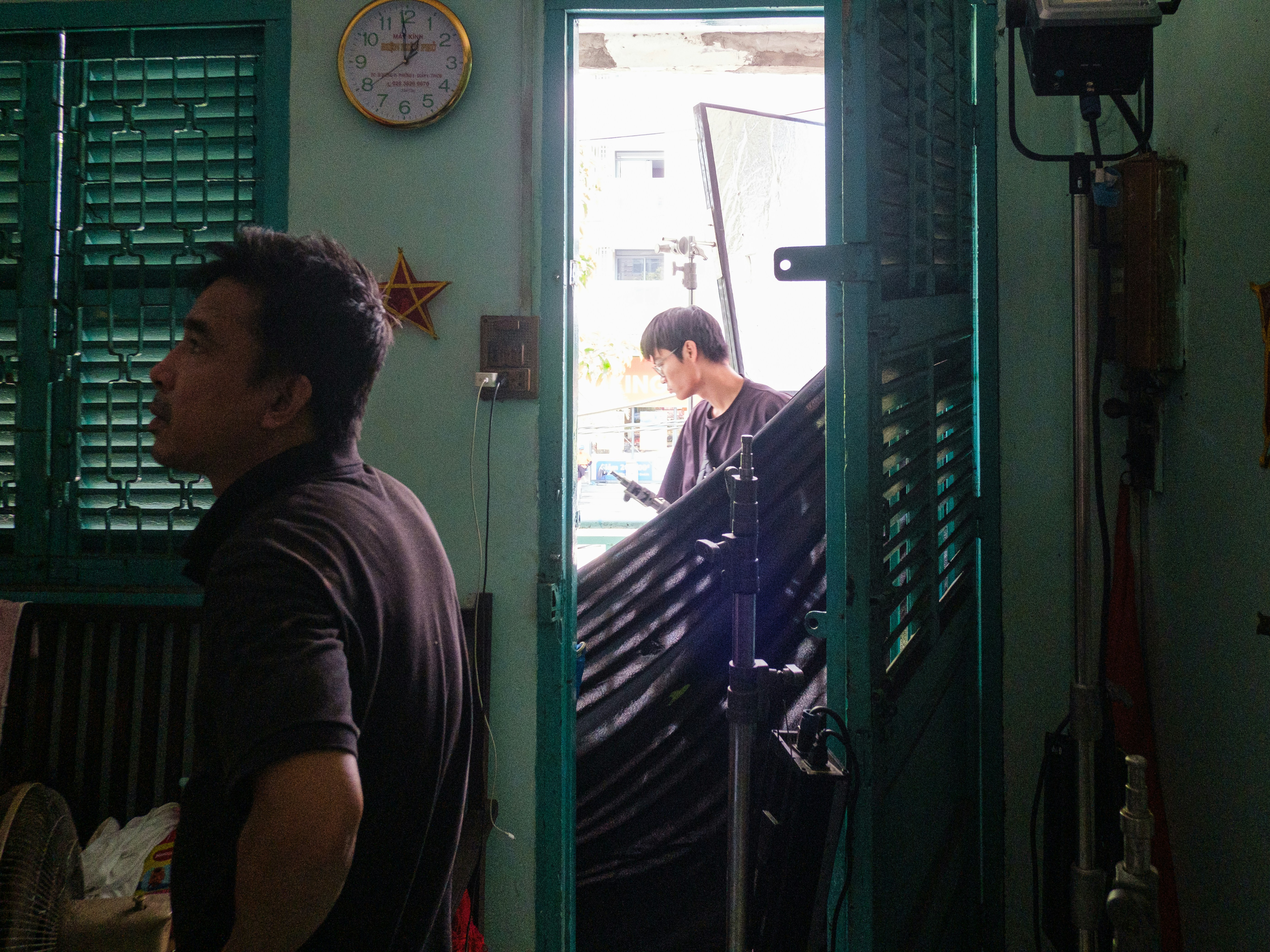 delivery team moving treadmill through doorway