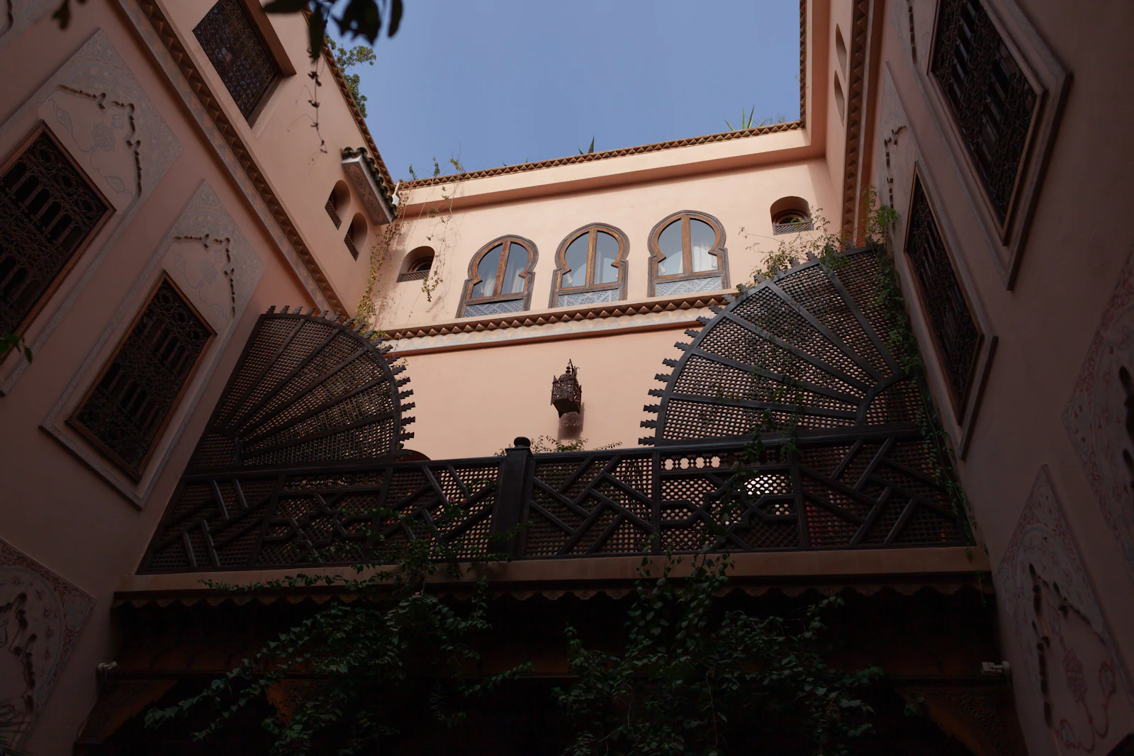Traditional Moroccan riad interior with intricate tilework, typical of nomad-friendly riads in Marrakech