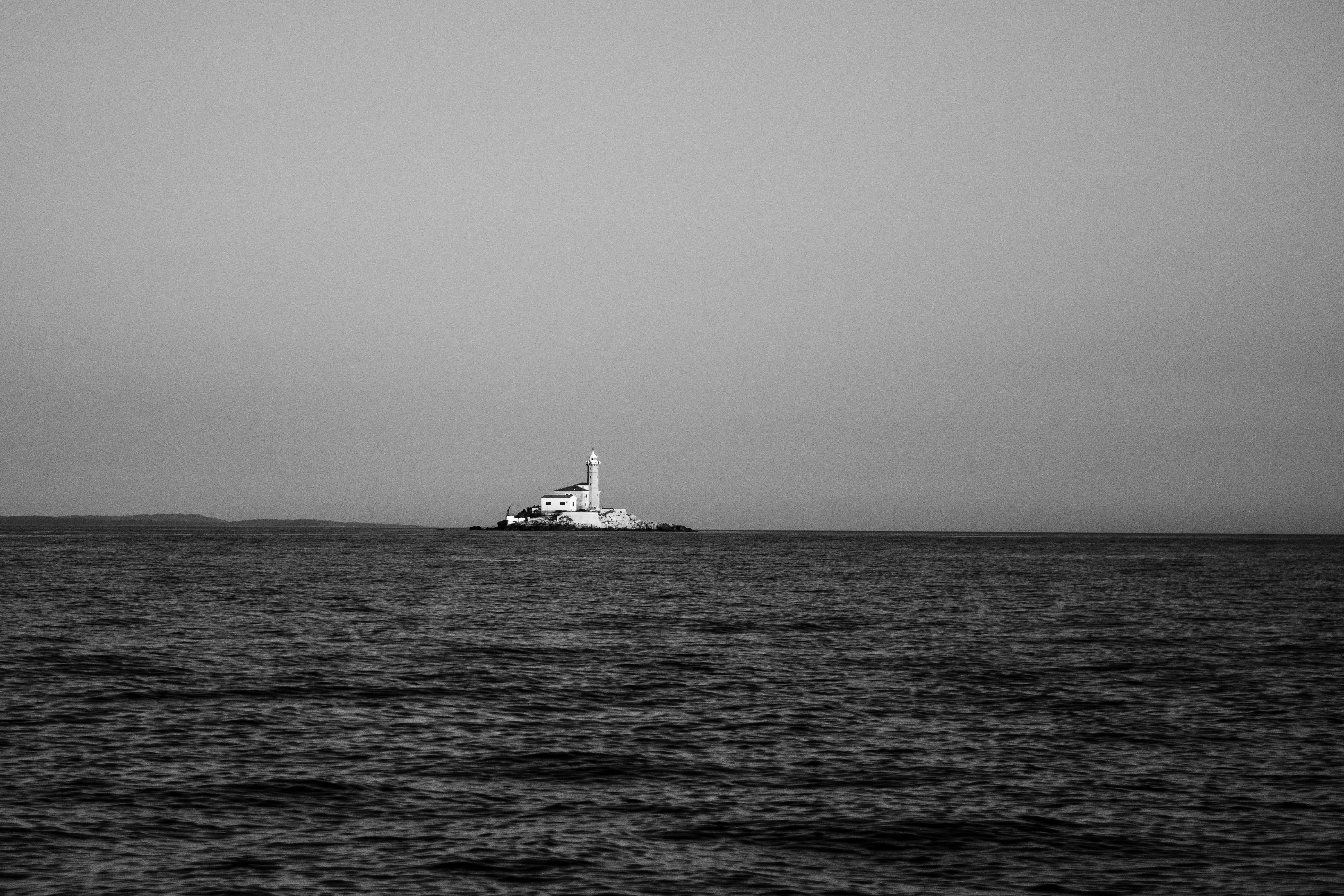Ocean A Distant Boat On The Ocean In Black And White. 4K Wallpaper #3594