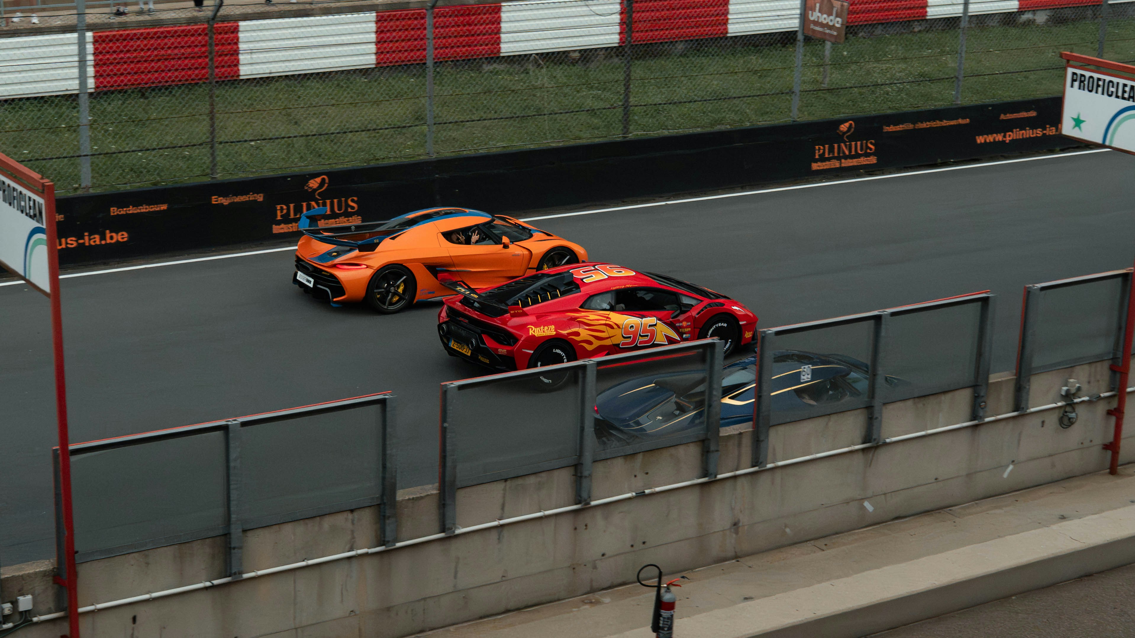 Cars Orange And Red Sports Cars Speeding On A Race Track. Full HD Wallpaper #3503