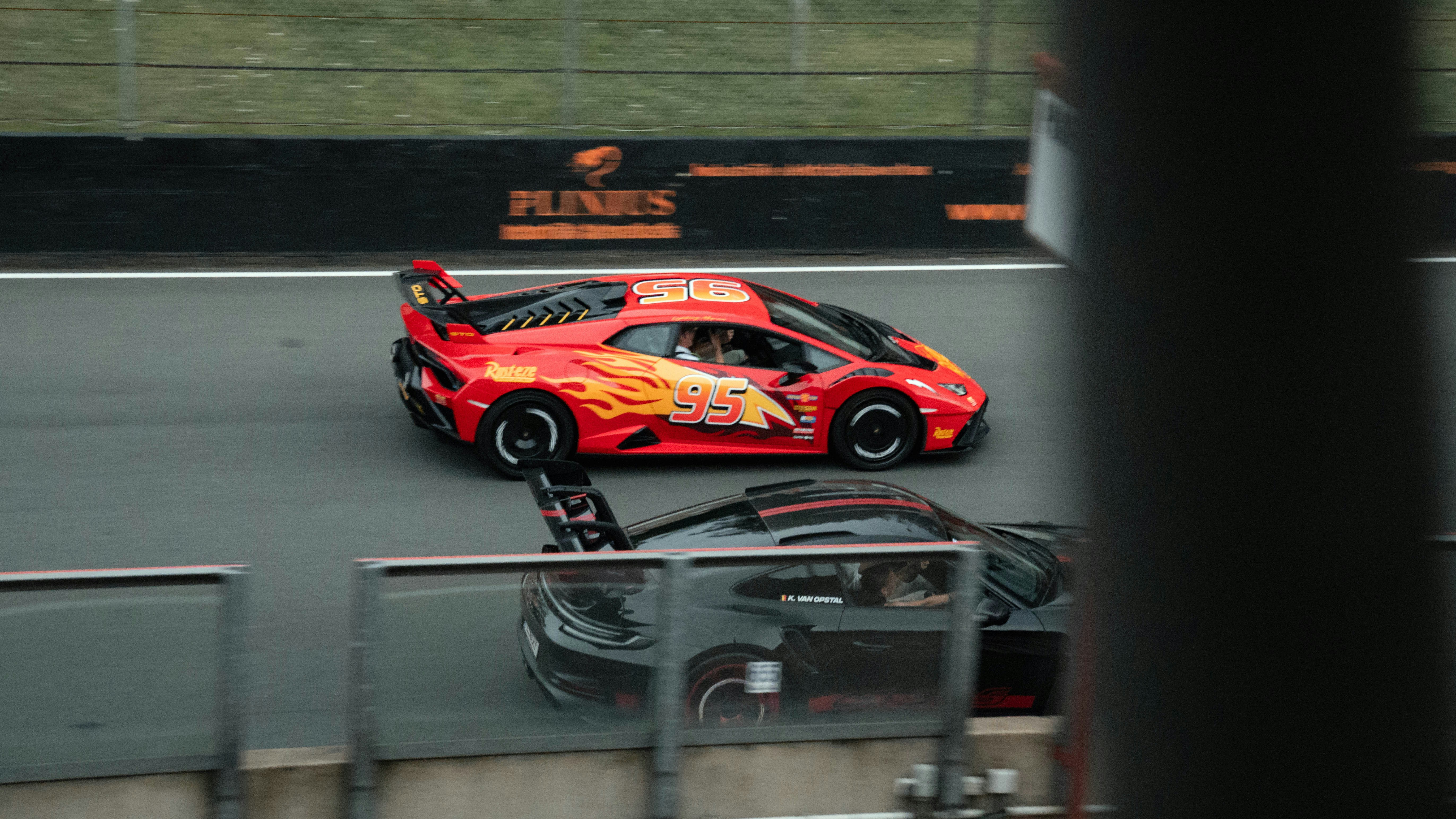 Cars Red Race Car With Flame Decals On A Track. 4K Wallpaper #3505