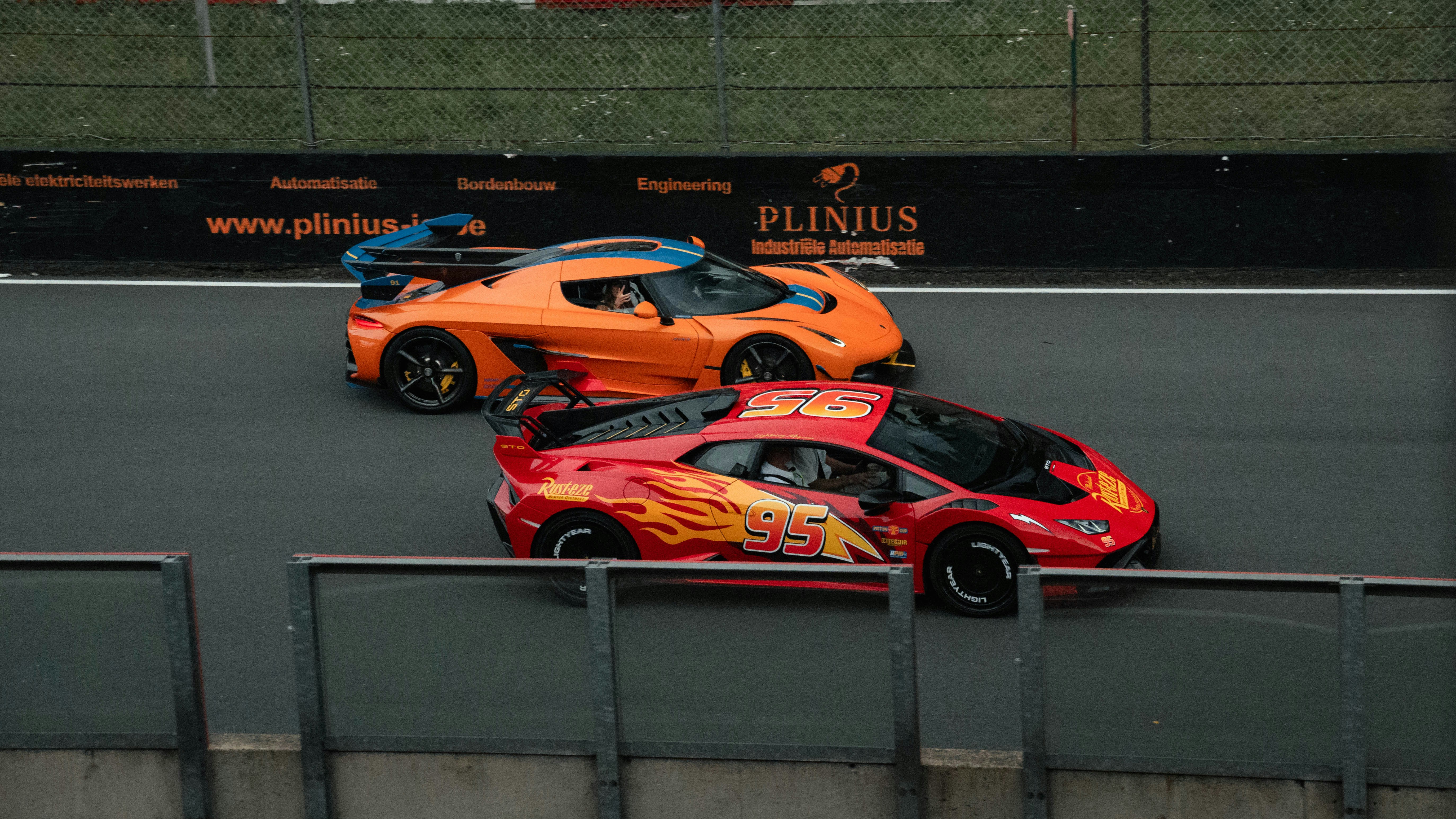 Cars Two Colorful Race Cars Speeding On A Track. 4K Wallpaper #3504