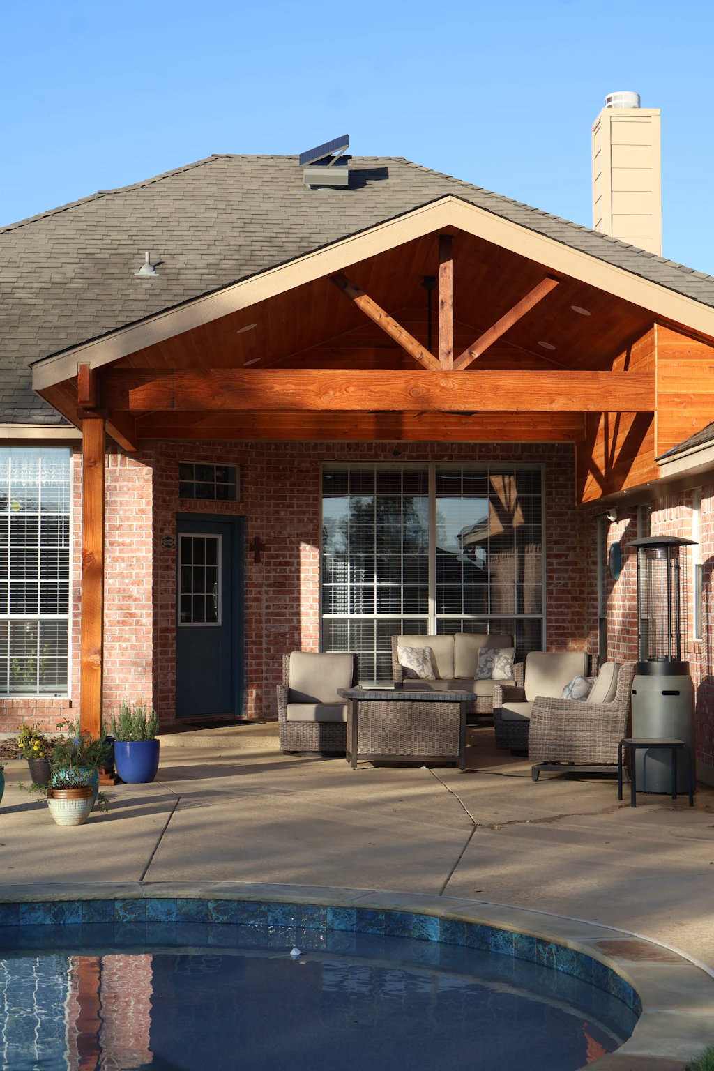 Covered patio with couch and outdoor furniture — Tampa Bay living
