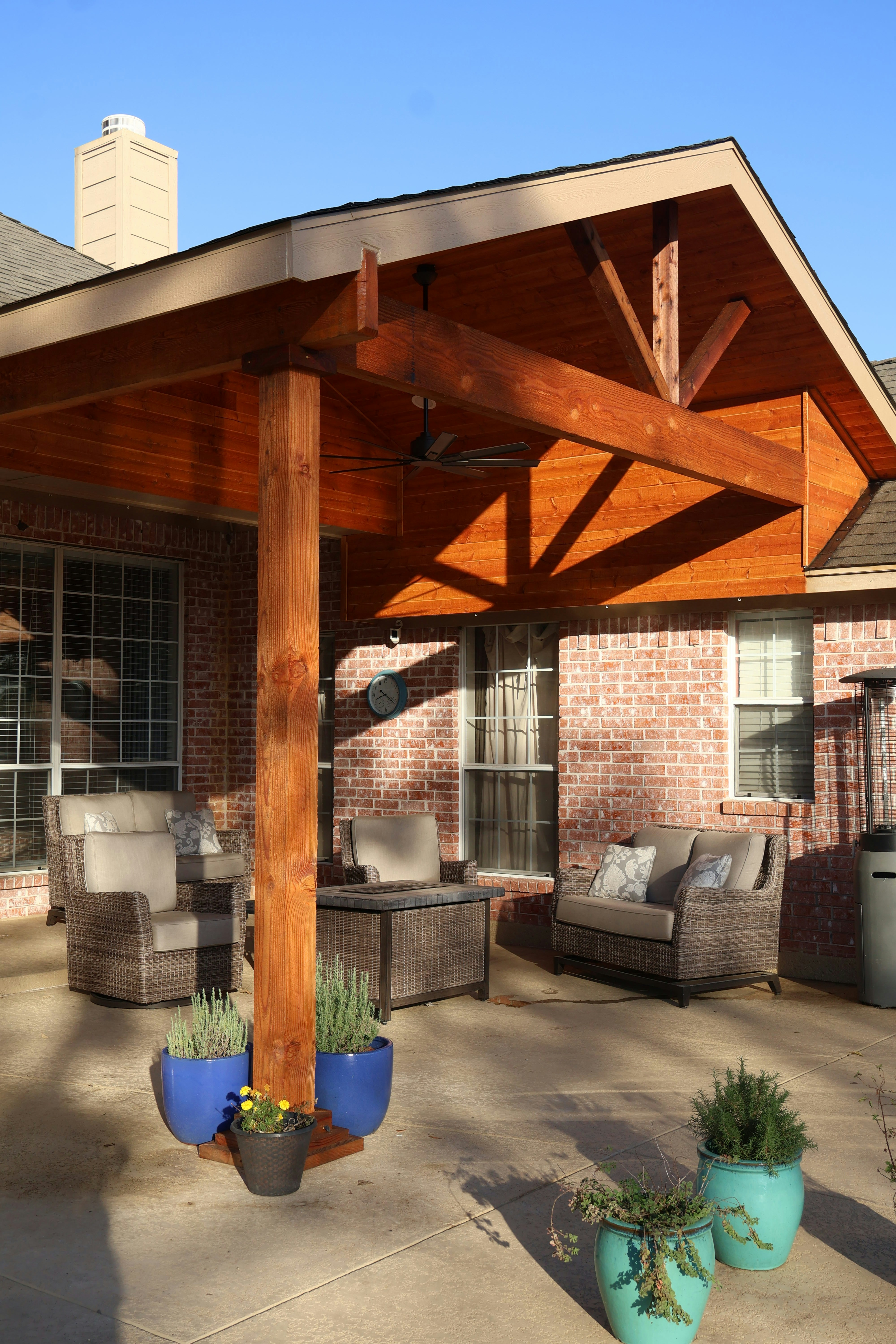 Custom outdoor pool with pergola and wicker furniture in a Florida backyard