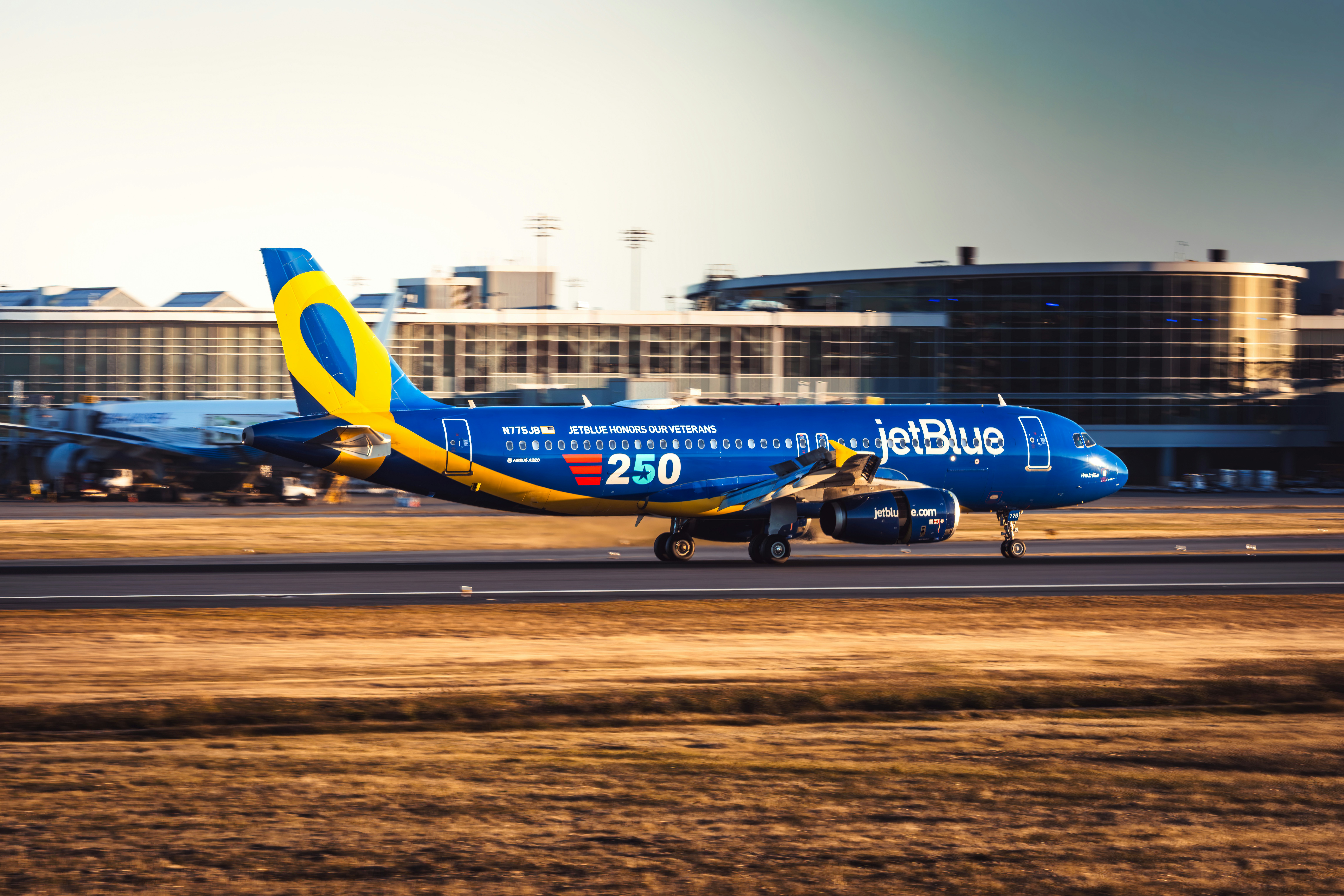 A jetblue aircraft on an airport runway.