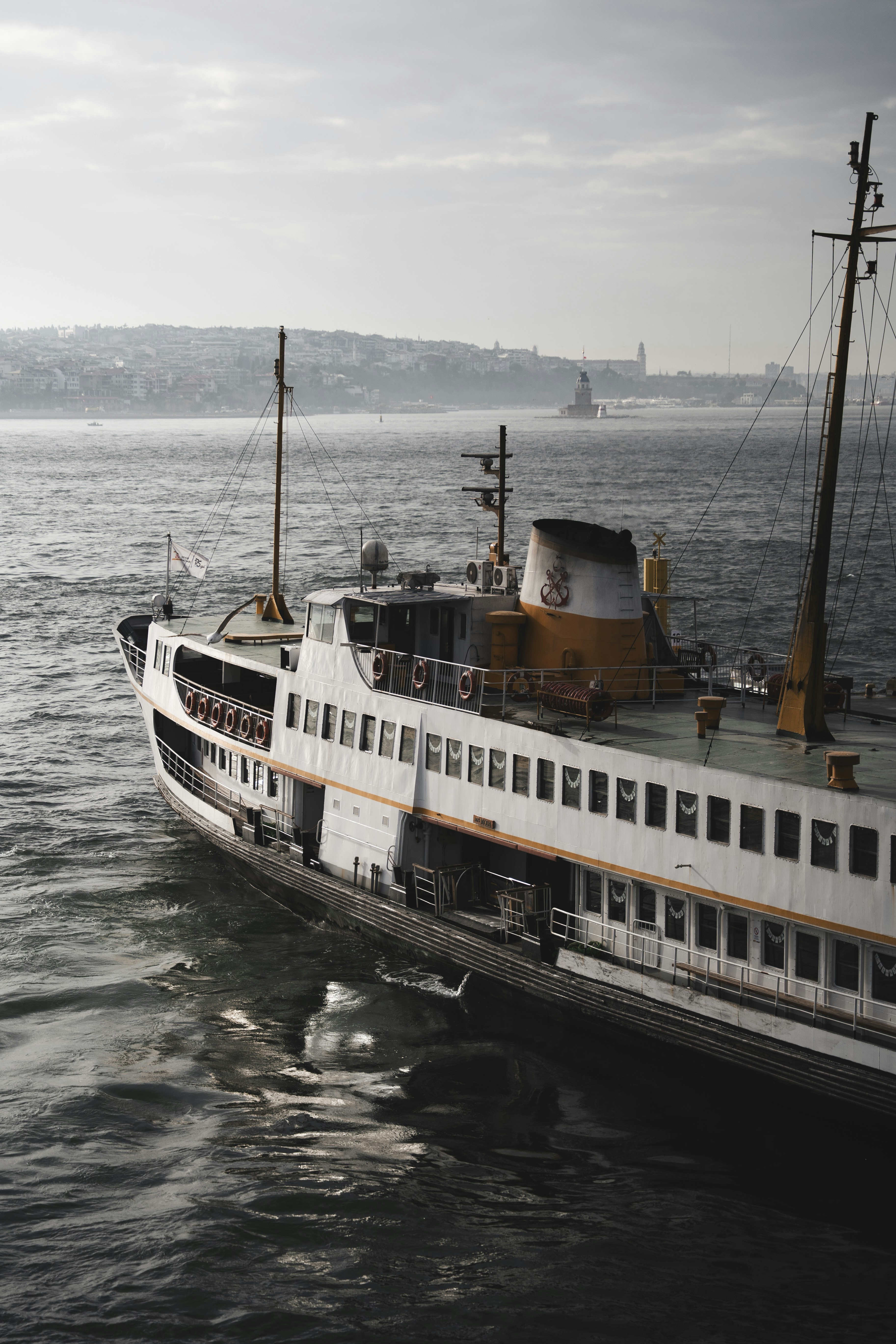 Ferry boat on choppy water with istanbul skyline