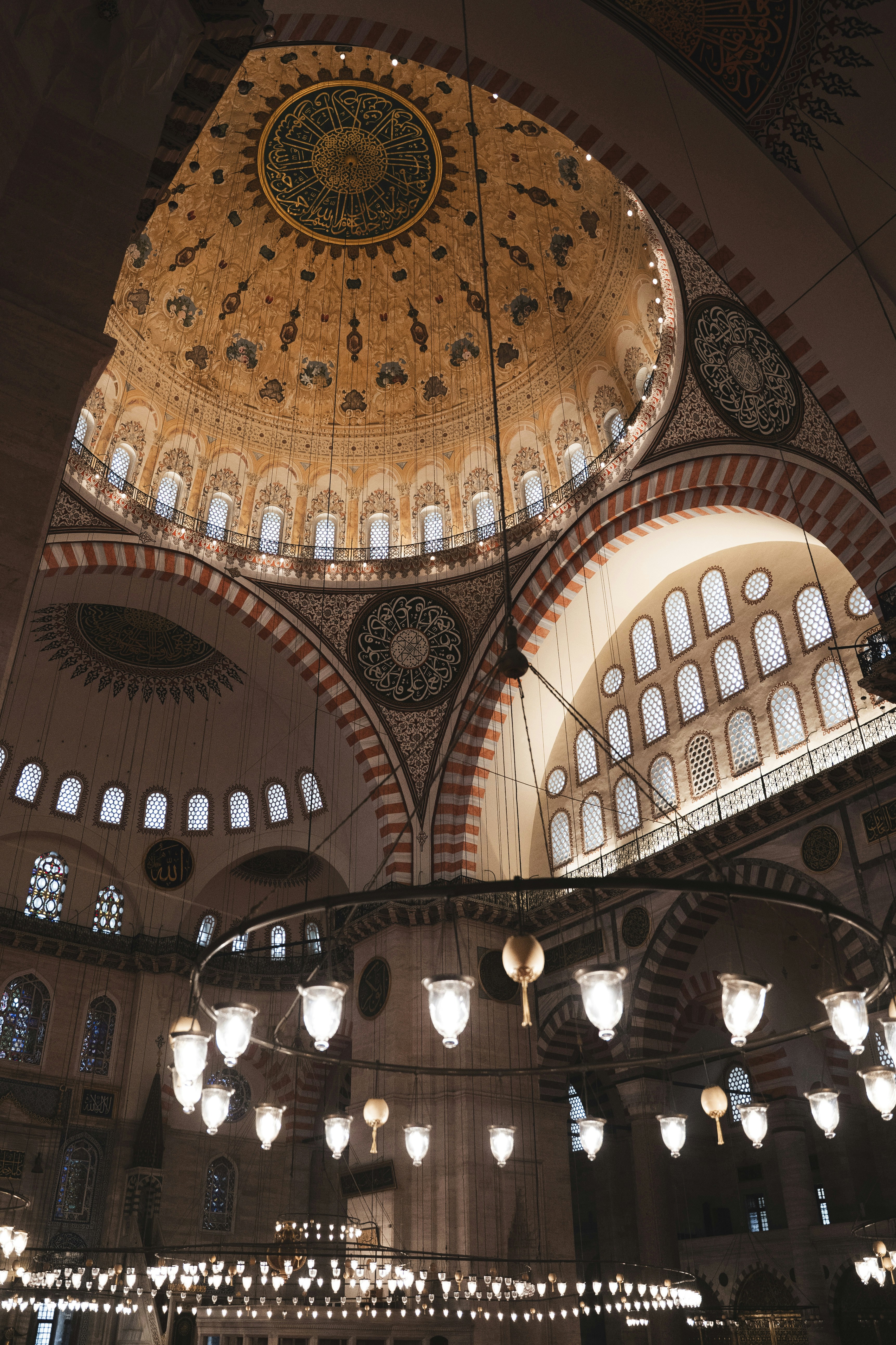 Ornate dome and chandeliers inside istanbul mosque