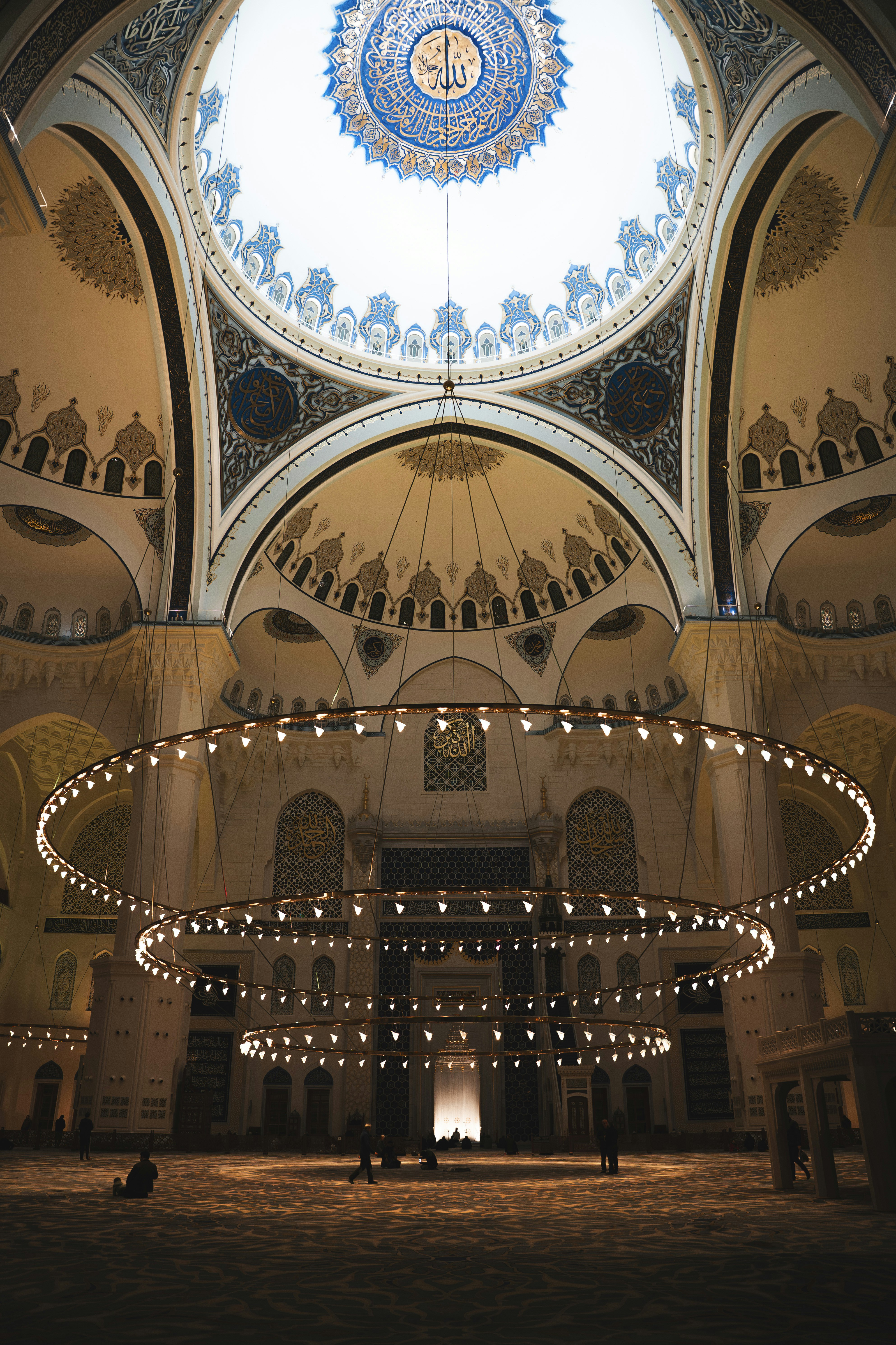 Istanbul mosque interior with grand chandelier and ornate dome