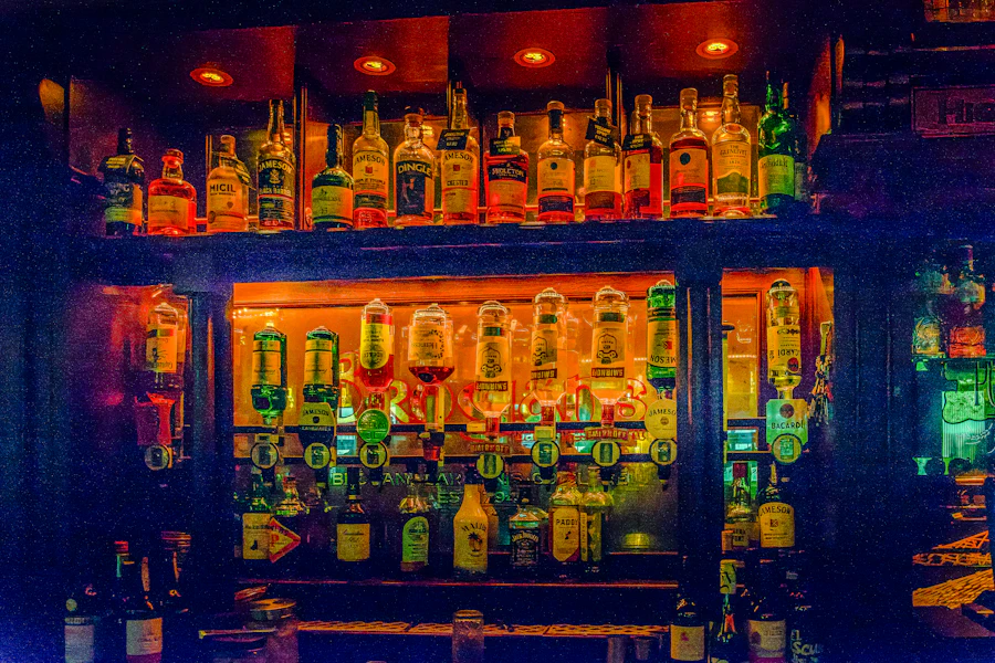 Bartender pouring drinks behind a busy bar