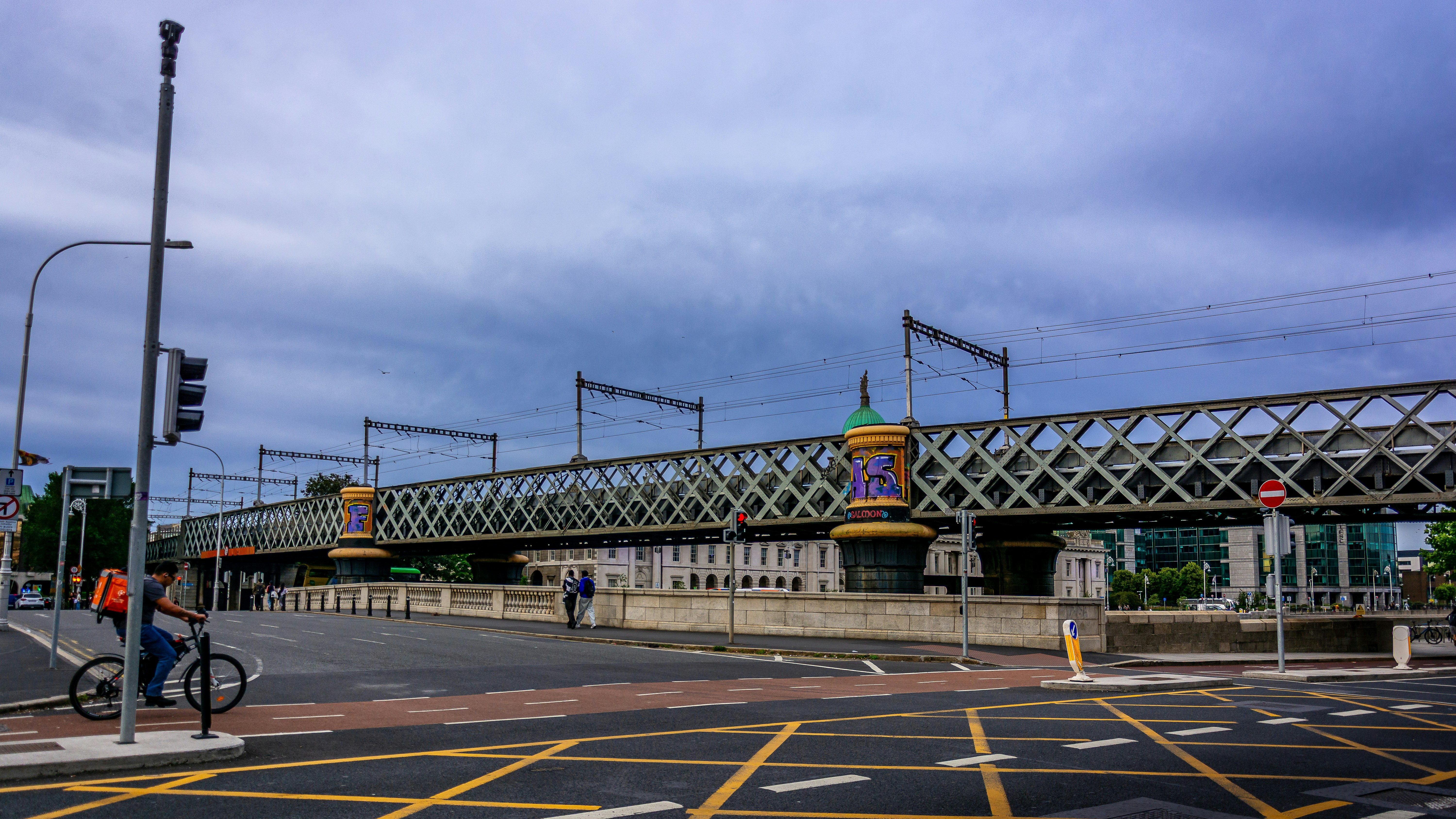 Metal railway bridge spanning a city street