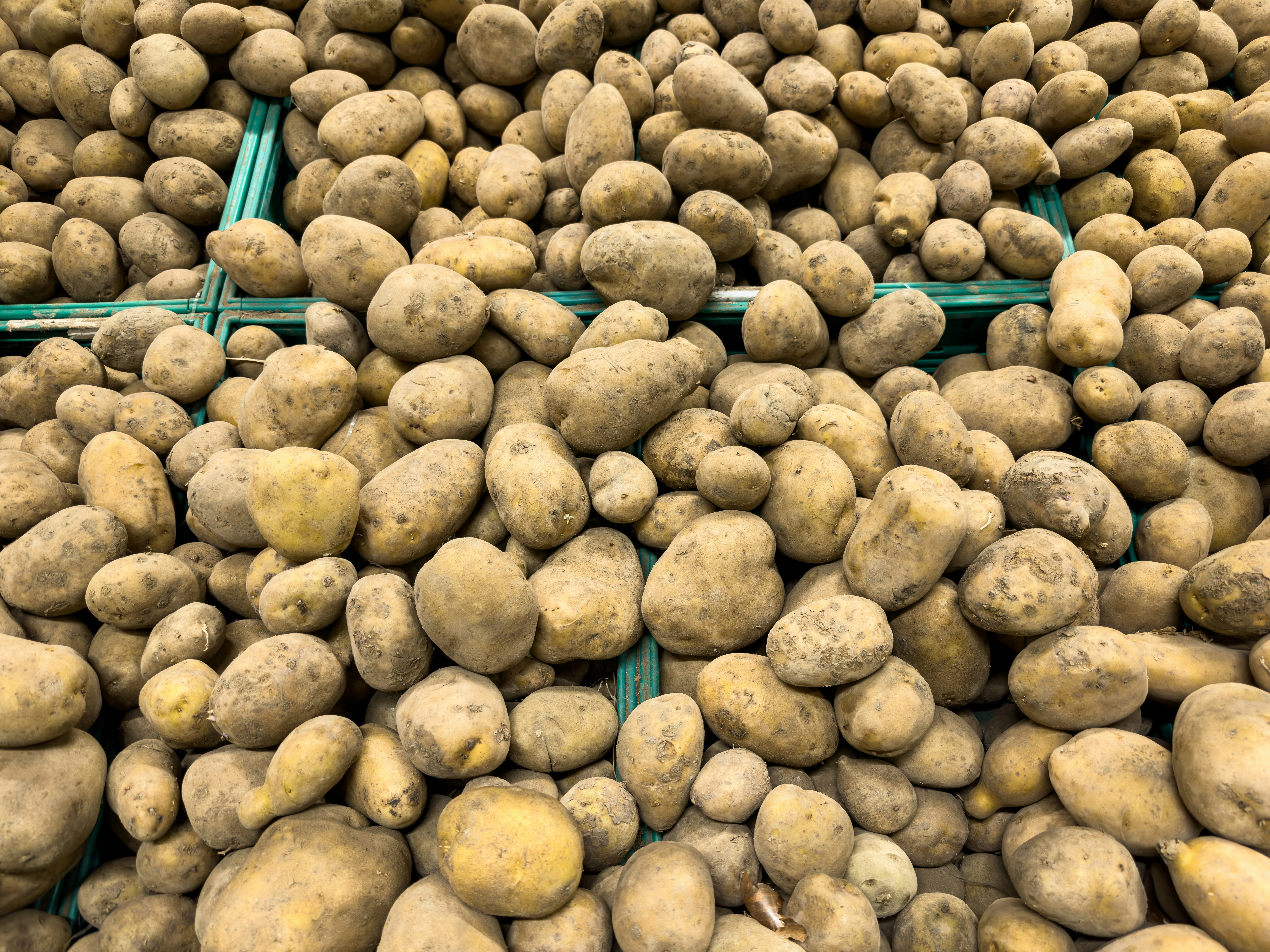 Fresh healthy potatoes at a market stall