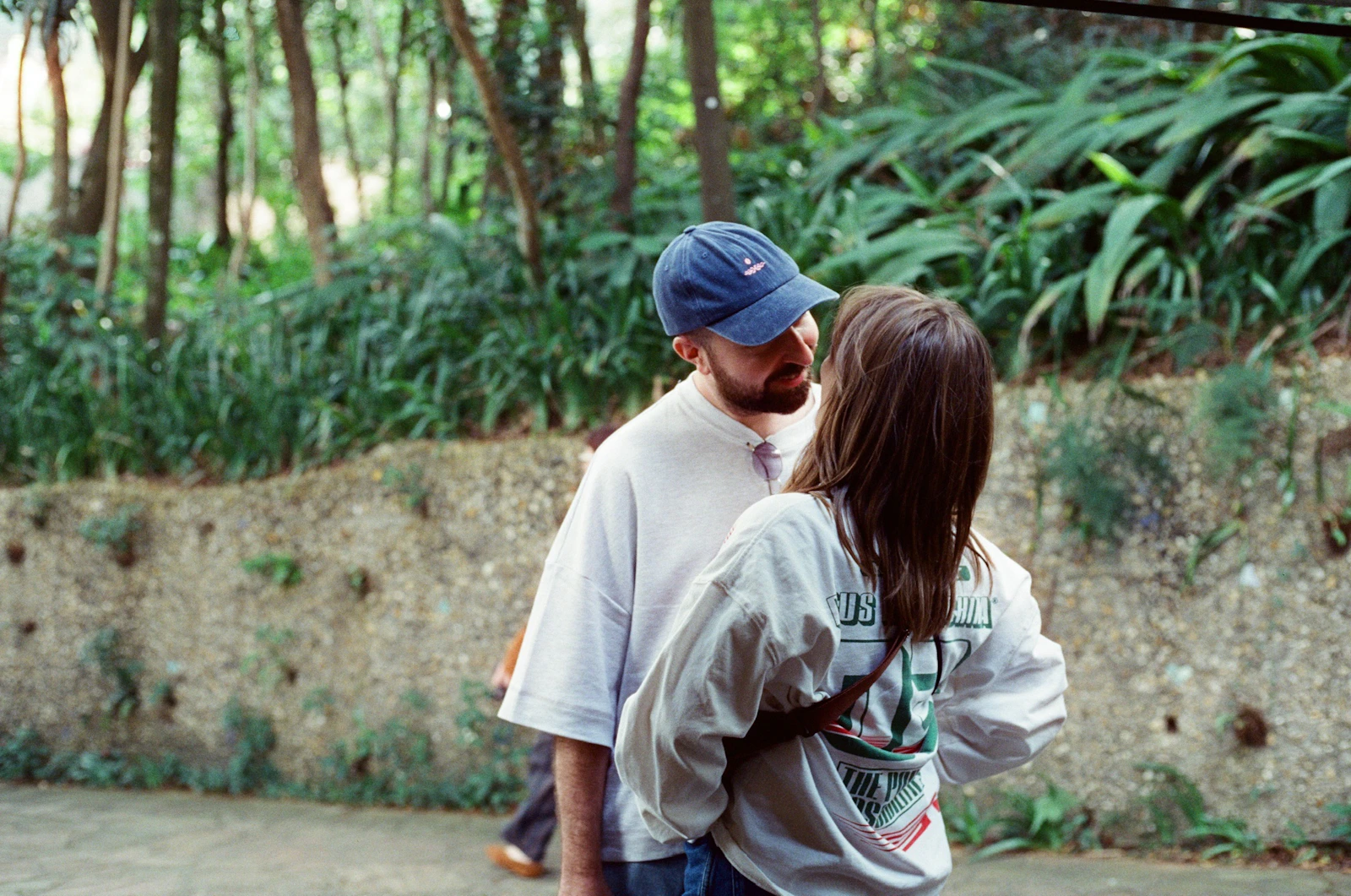 Couple looking at each other during a conversation outdoors, representing healthy communication and emotional connection