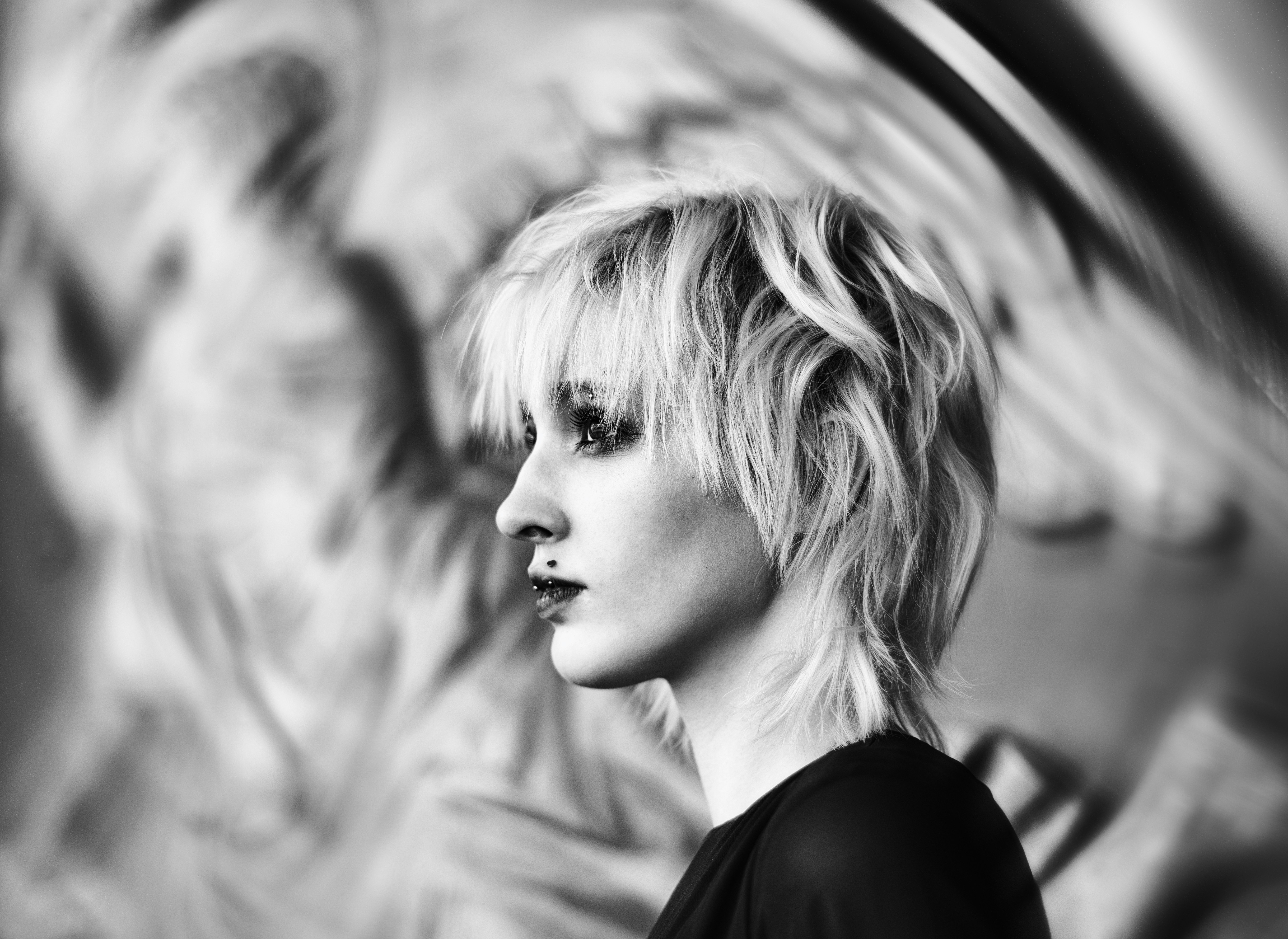 A woman with short light hair in profile.