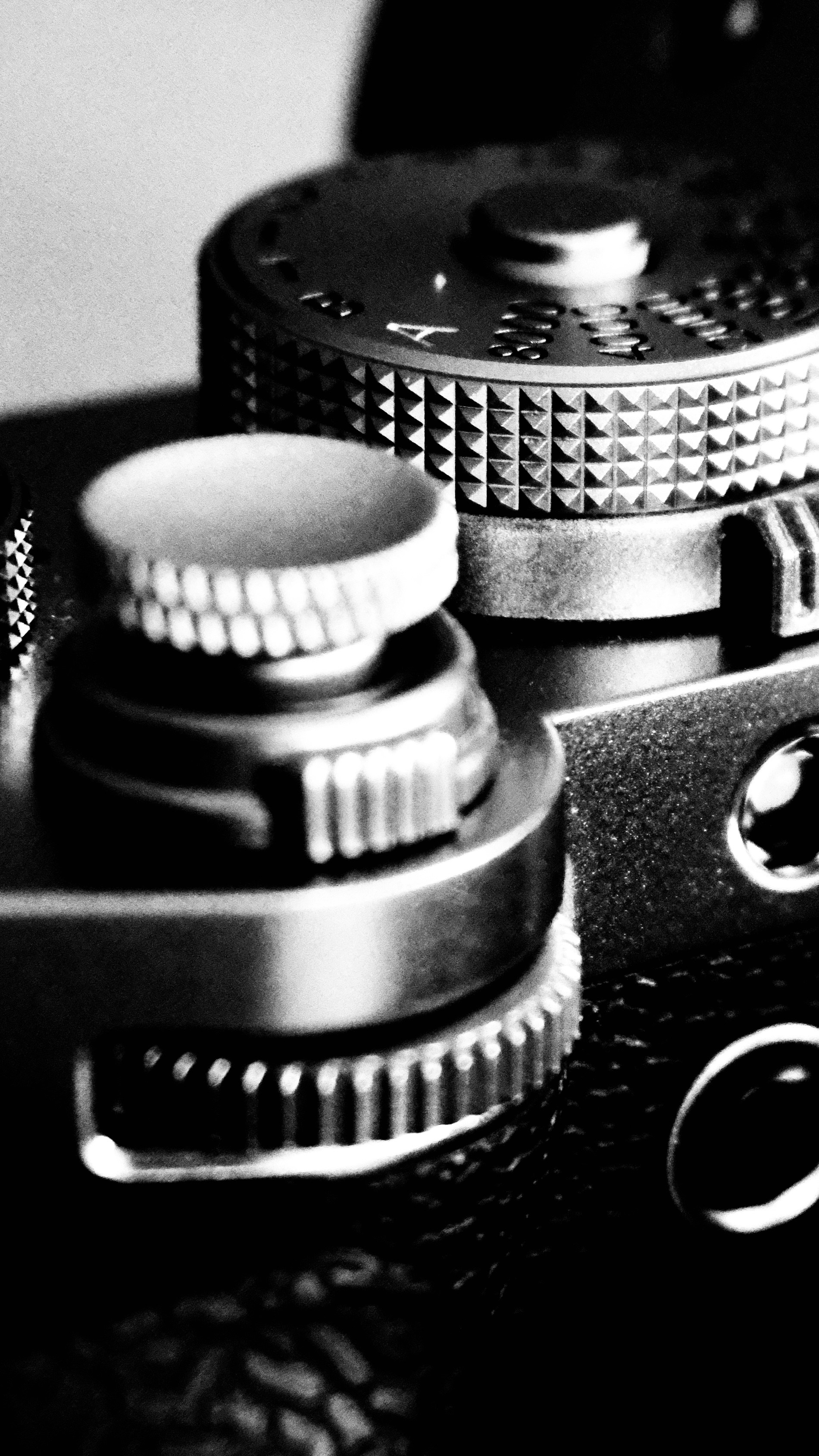 Vintage camera dials and controls in black and white