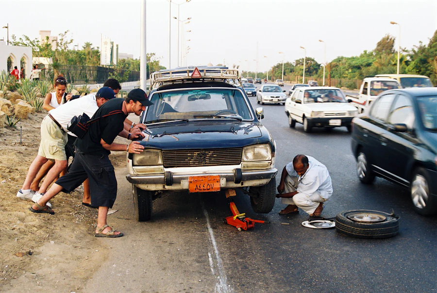 Roadside help changing a flat tire