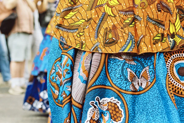 Vibrant wax-print fabric with bird and butterfly motifs