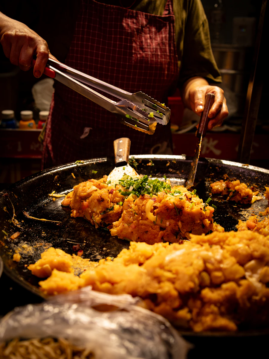 Crispy oyster omelette being cooked at Nai Mong