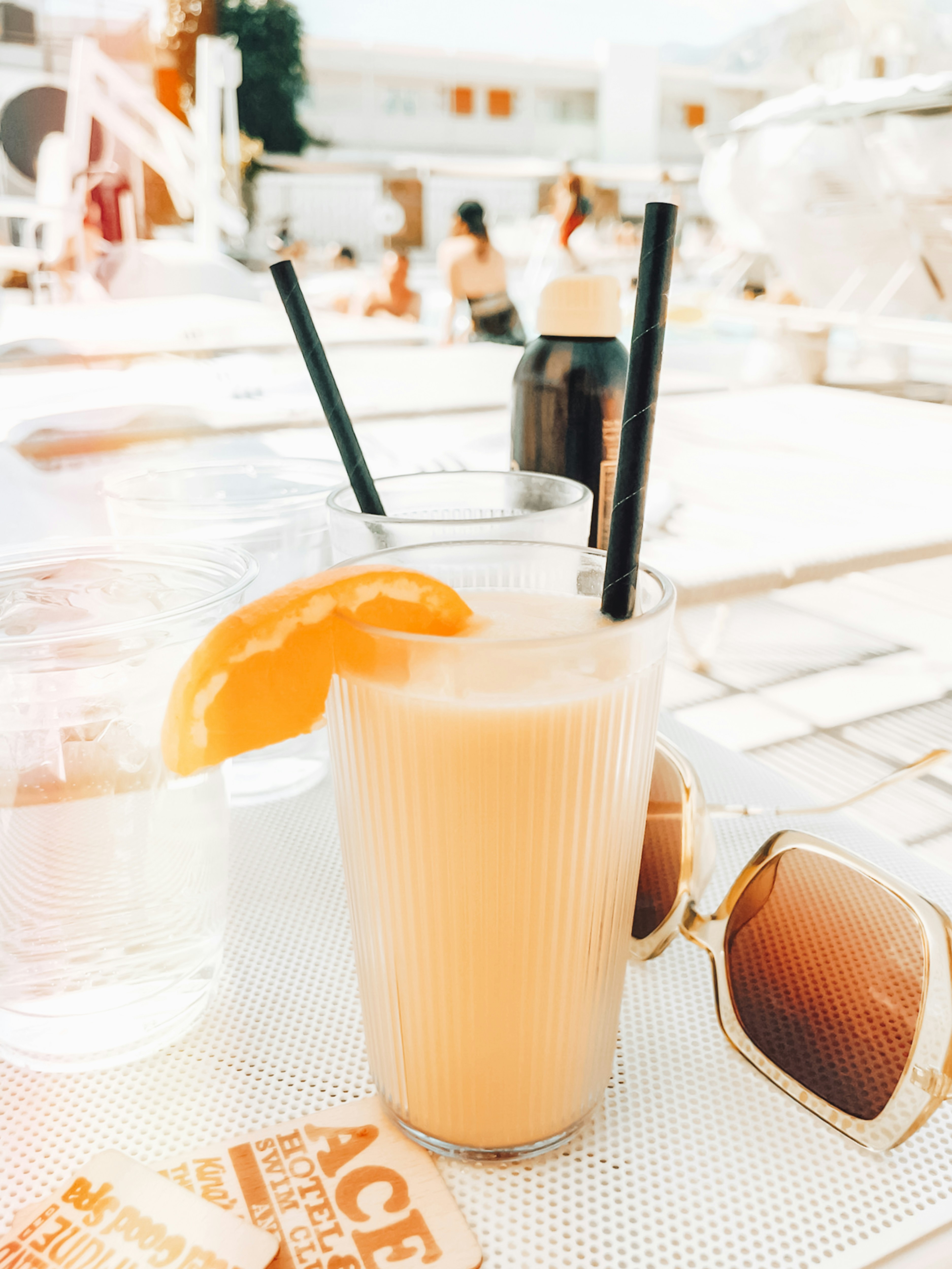 Drink and sunglasses at ace hotel palm springs