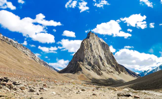 A majestic mountain peak in a vast rocky valley