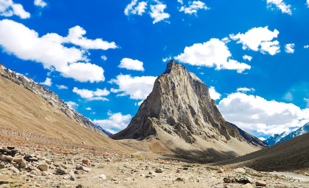 A majestic mountain peak in a vast rocky valley