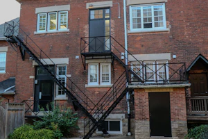 Old brick building with a black metal fire escape