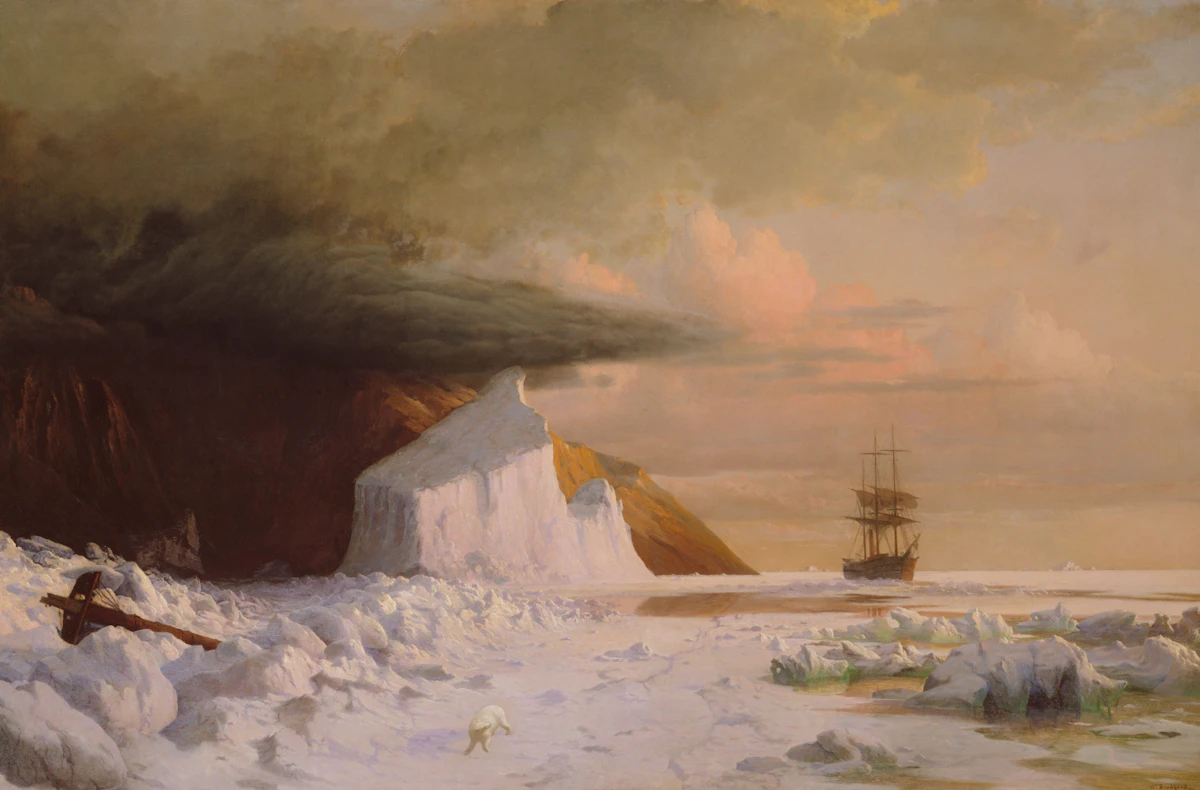 Expedition ship navigating icy Arctic waters beneath a dramatic sky