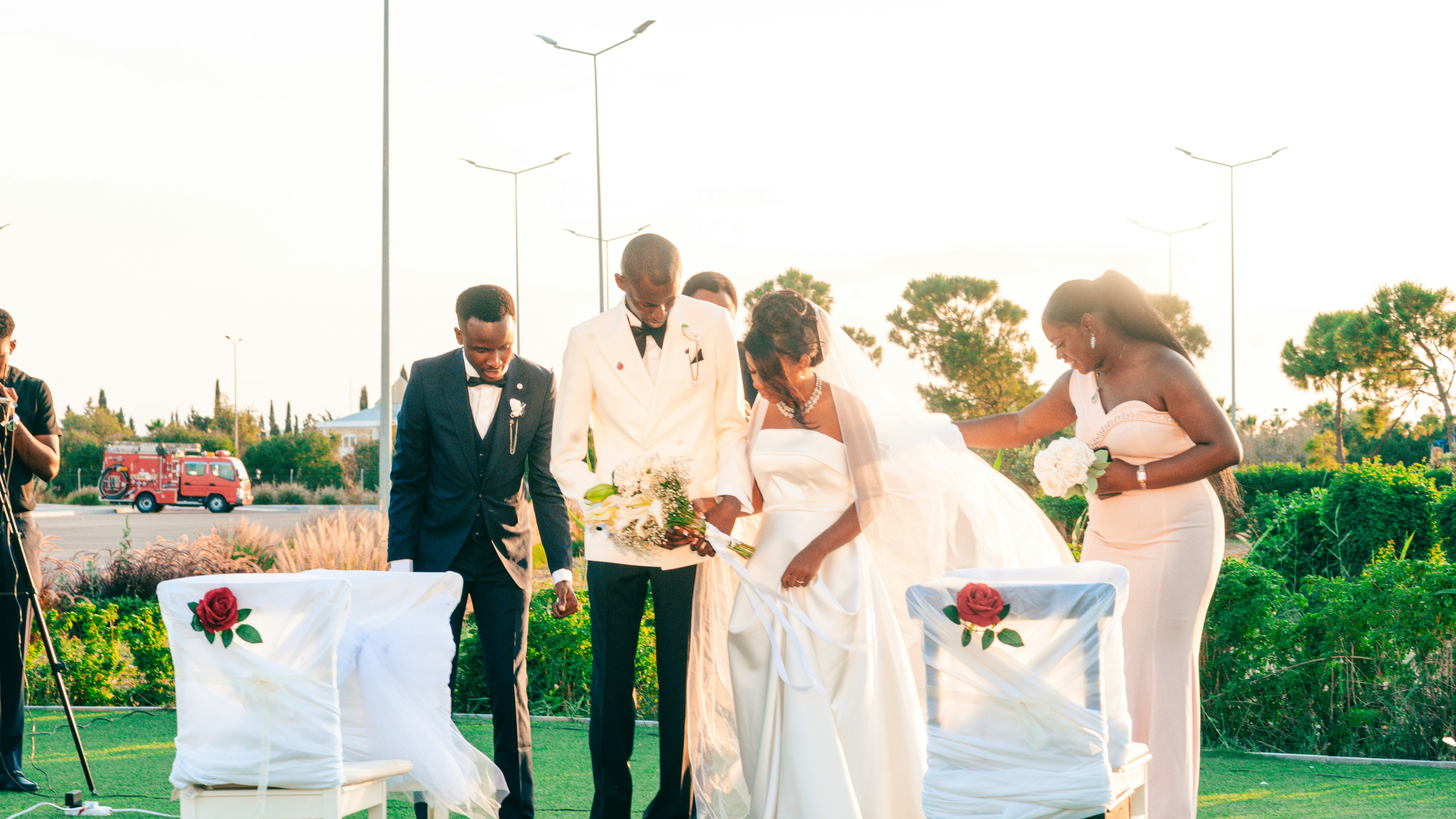 A bride and groom at an outdoor wedding ceremony.