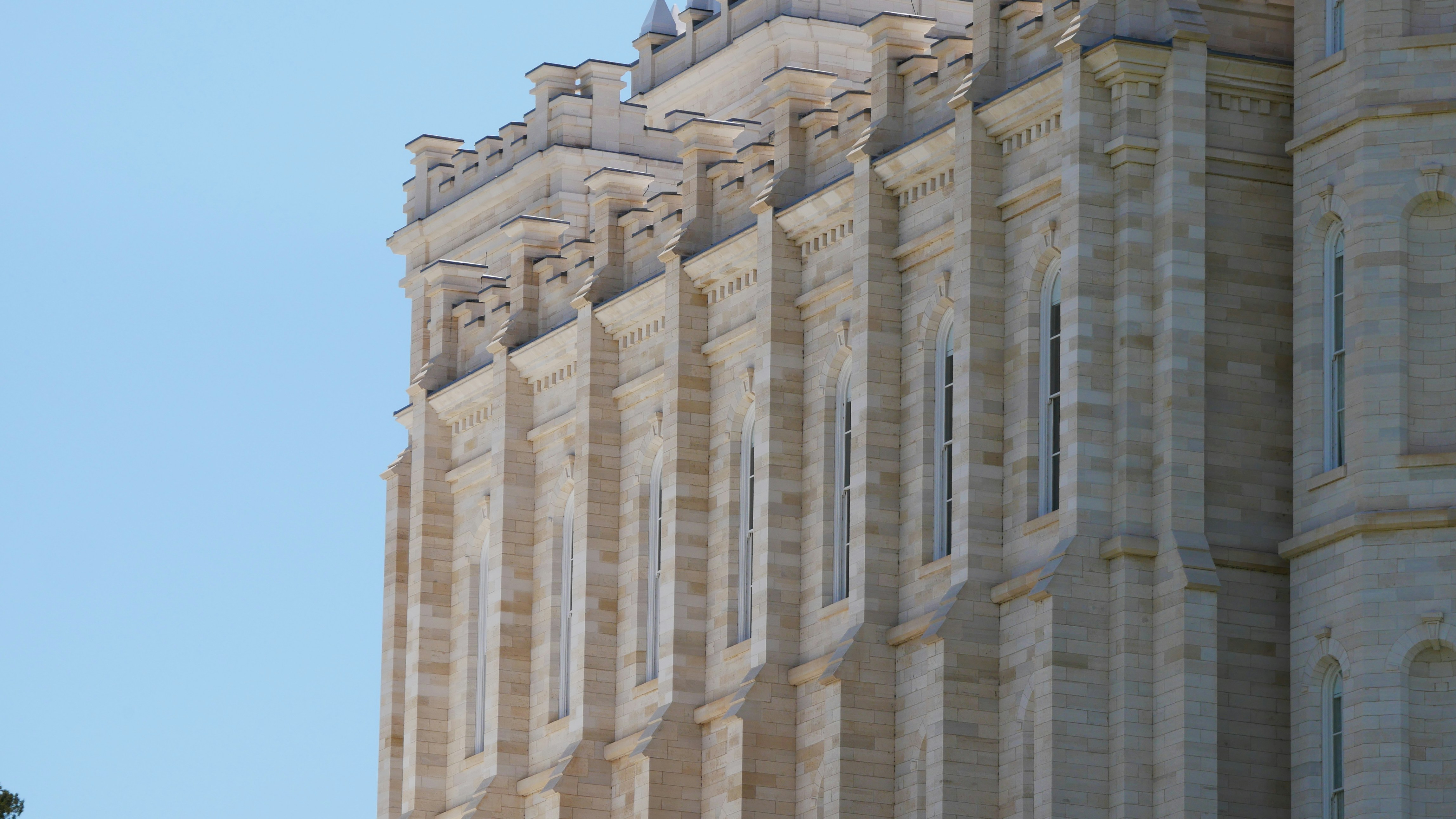 Grand stone building facade featuring intricate columns and details.
