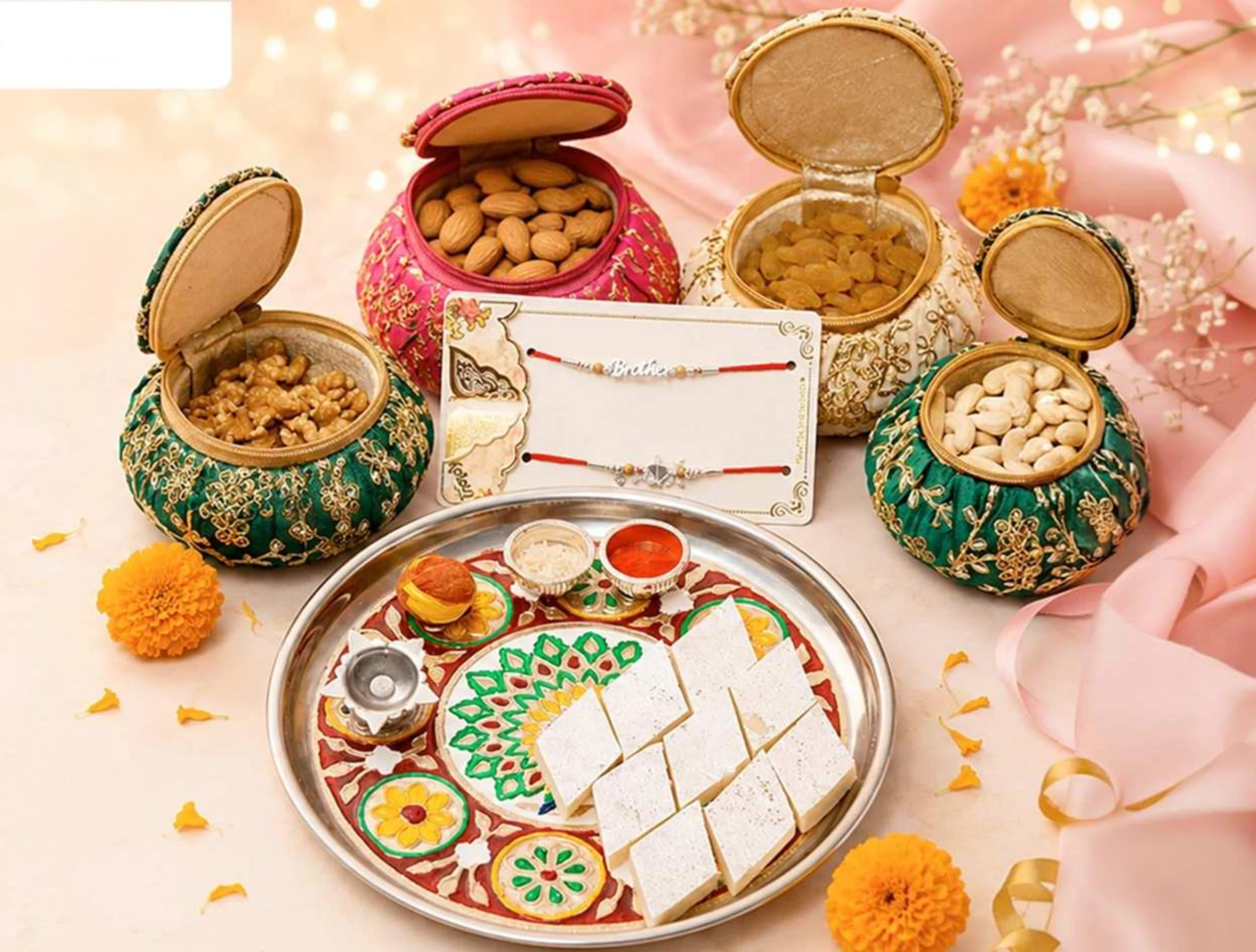 Raksha Bandhan setup with rakhis, sweets and dry fruits
