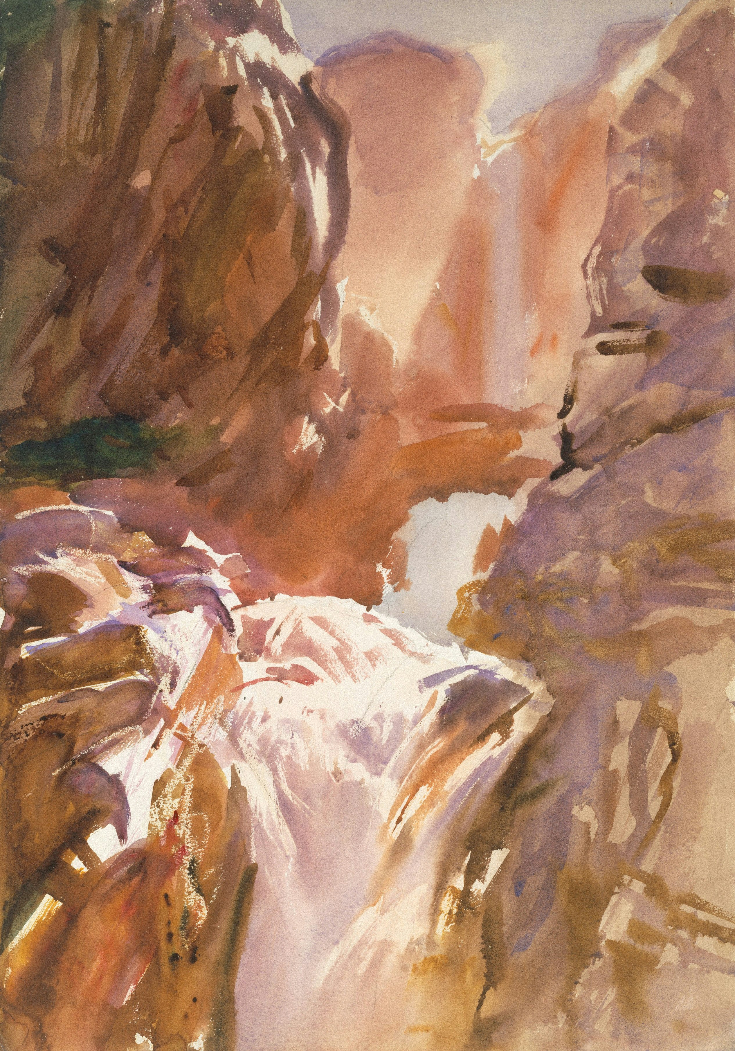 Sunlight illuminates a rugged canyon with a cascading waterfall.