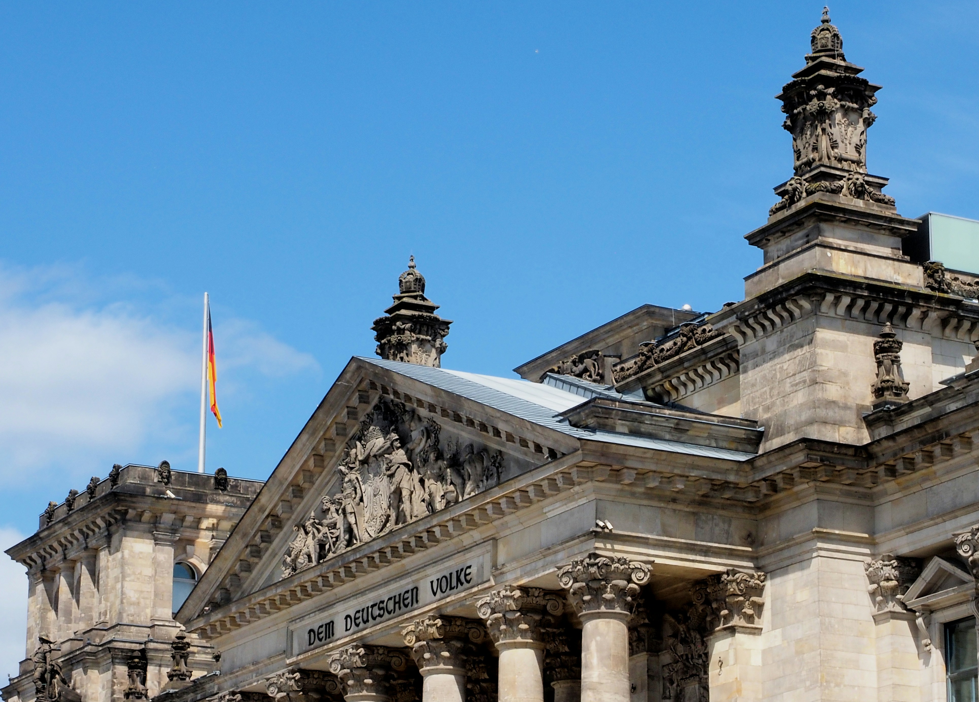 The reichstag building in berlin under a blue sky