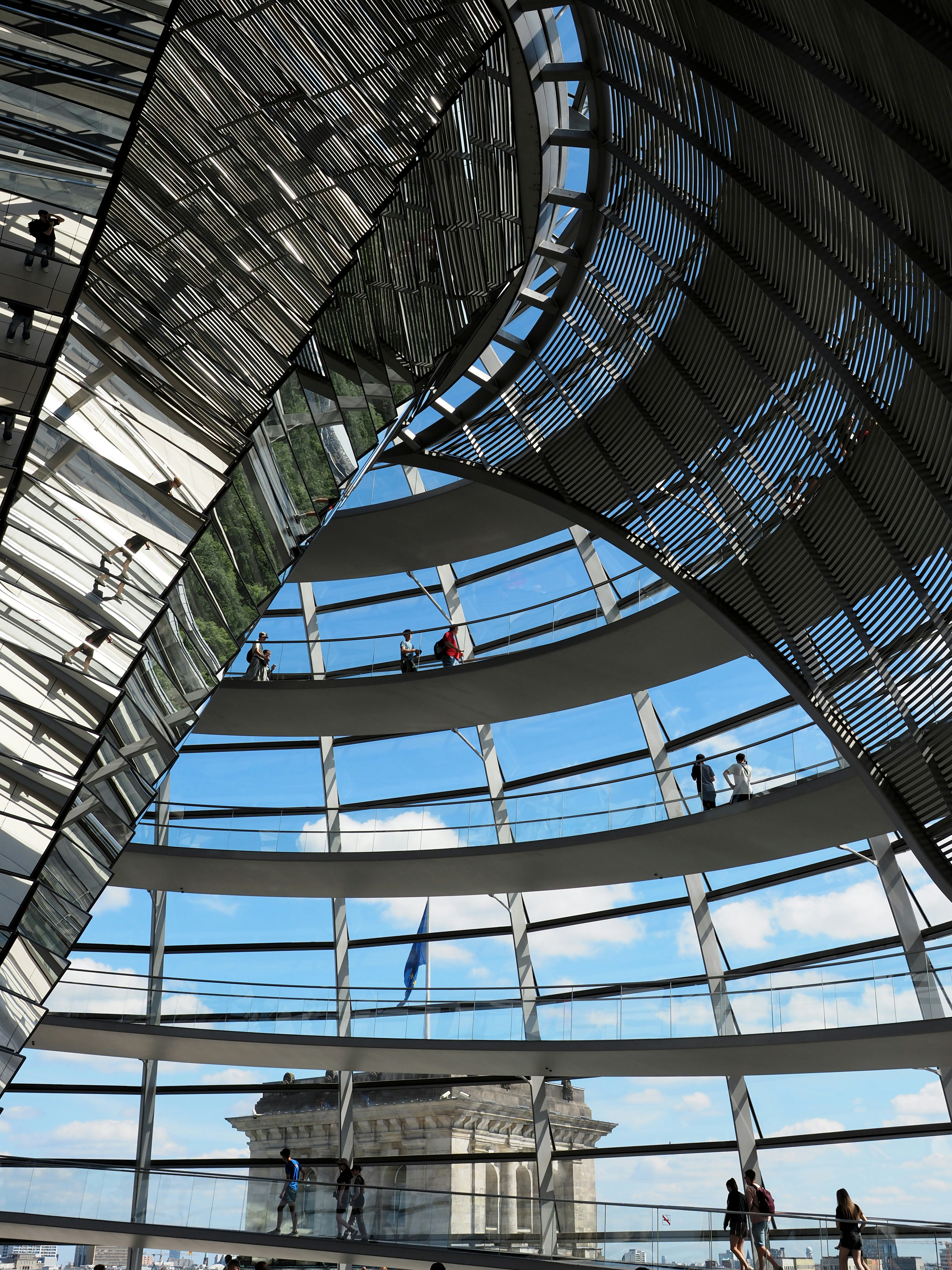 Tourists explore the reichstag dome with a city view