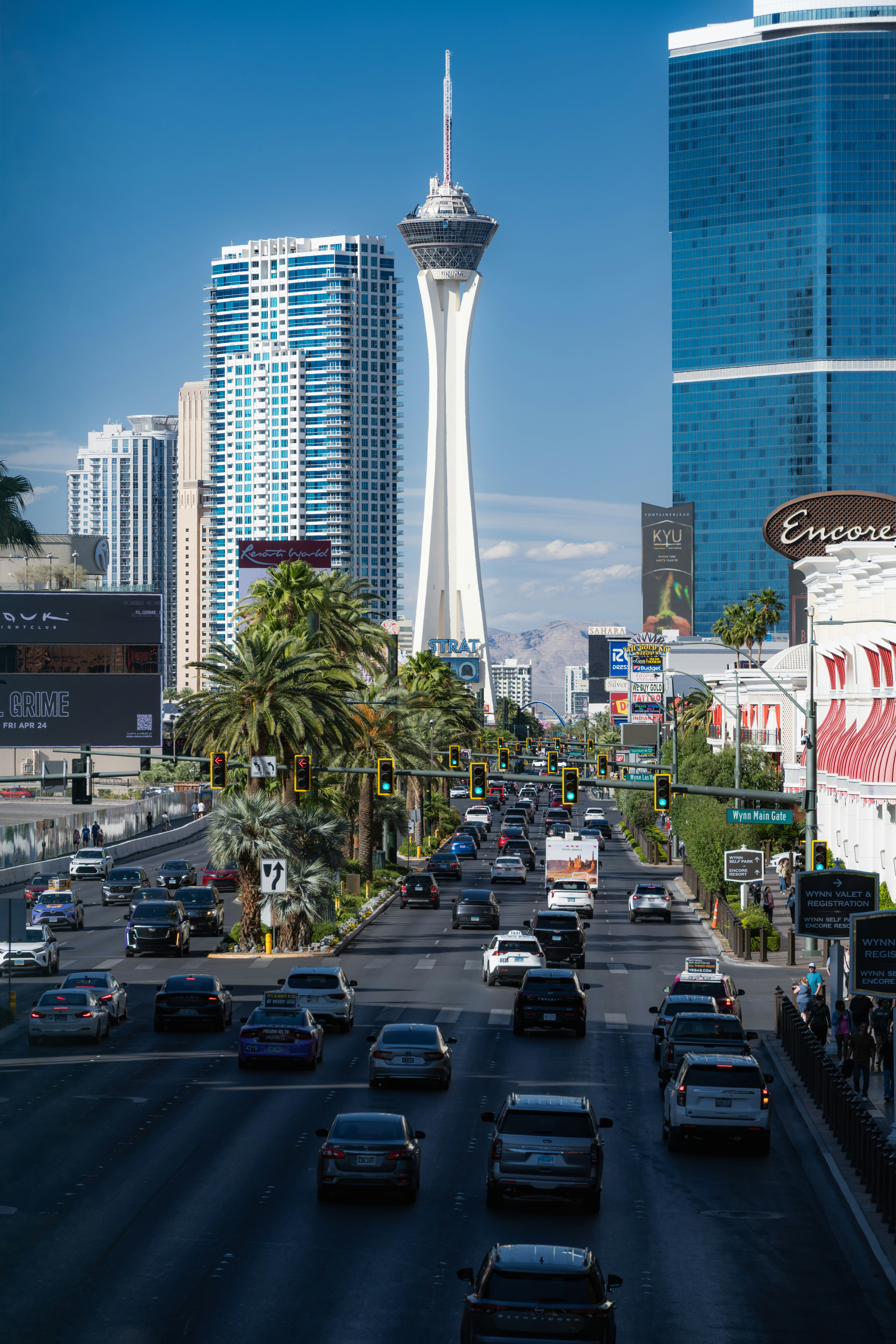 Las vegas strip with traffic and the iconic stratosphere tower.