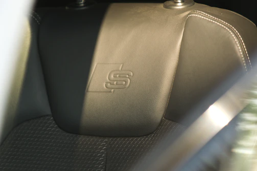 Car seat headrest with an s logo.
