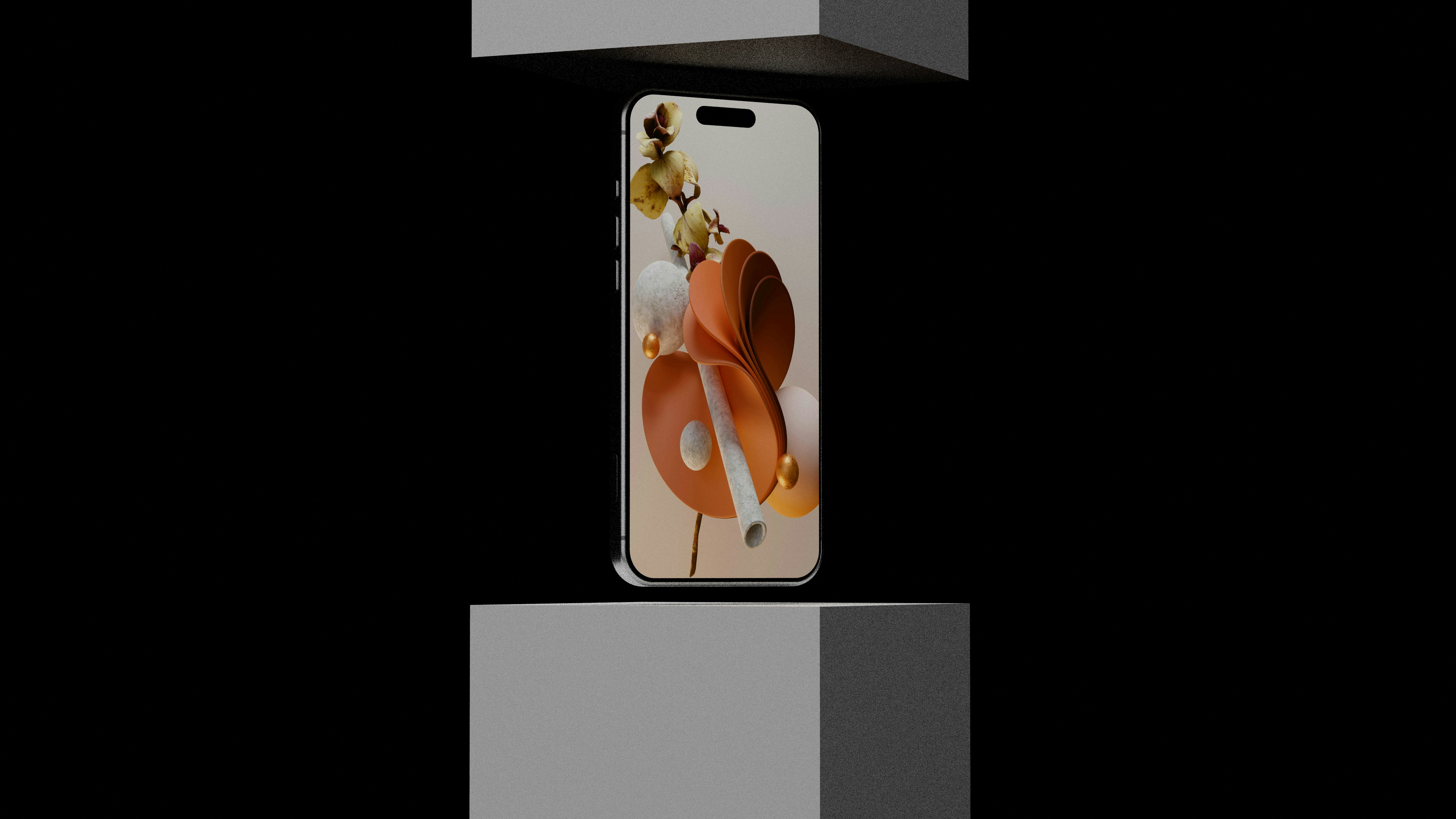 A smartphone between two gray blocks on a black background