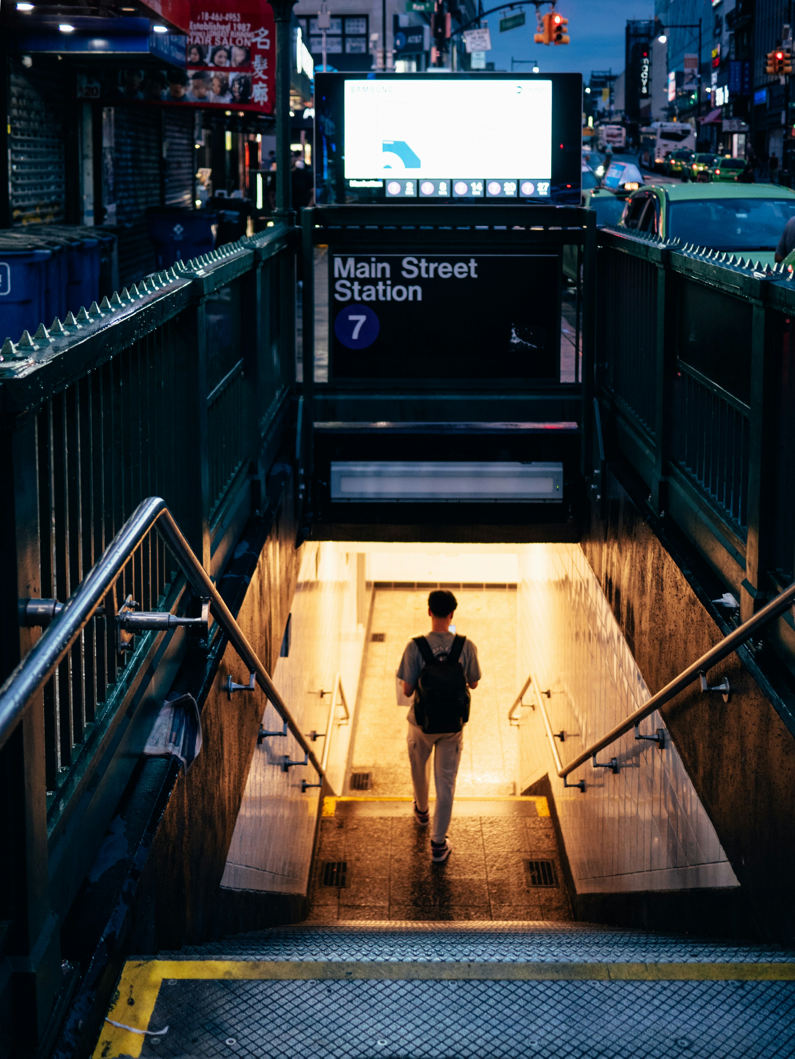 A person enters the main street subway station.