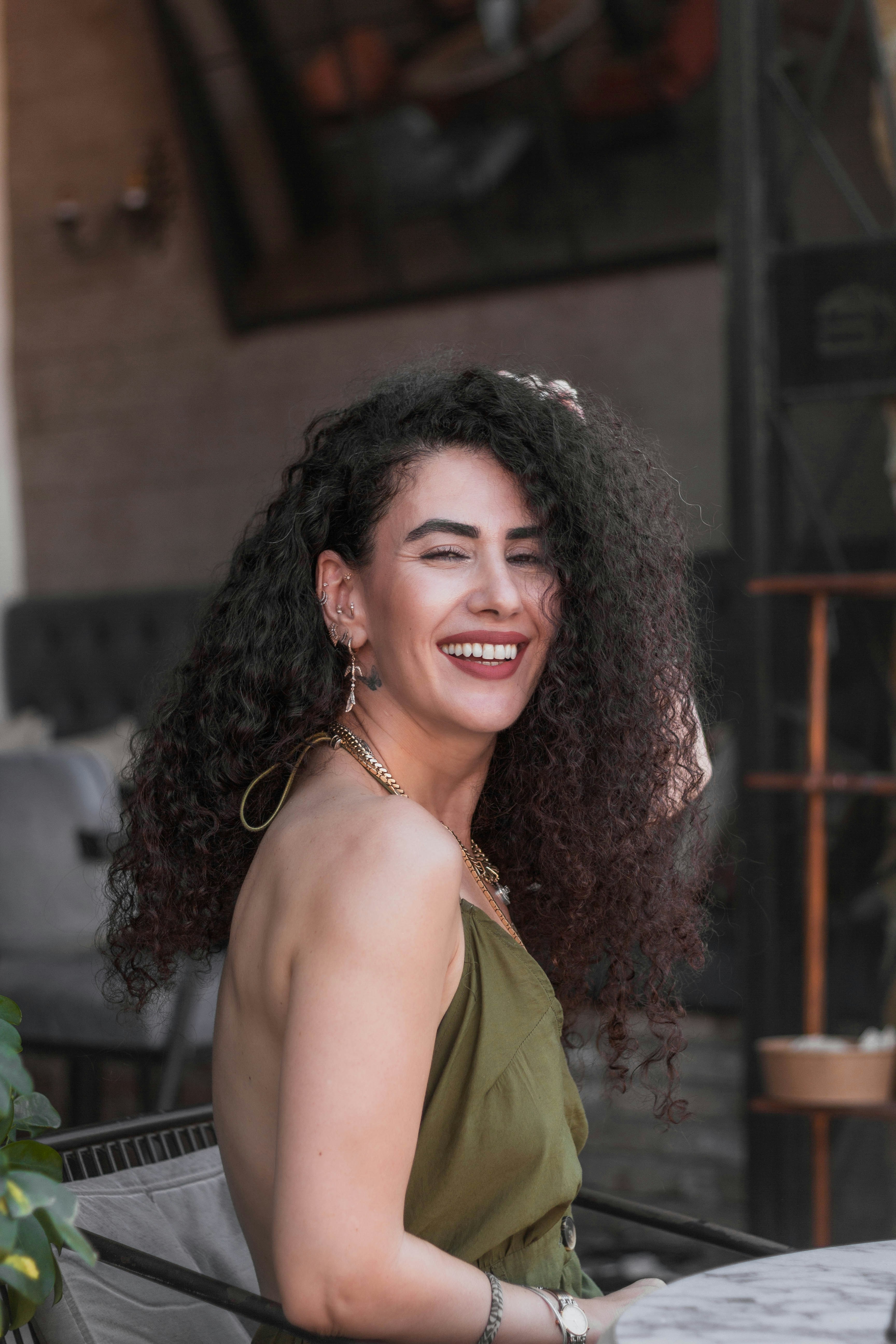 Smiling woman with curly hair