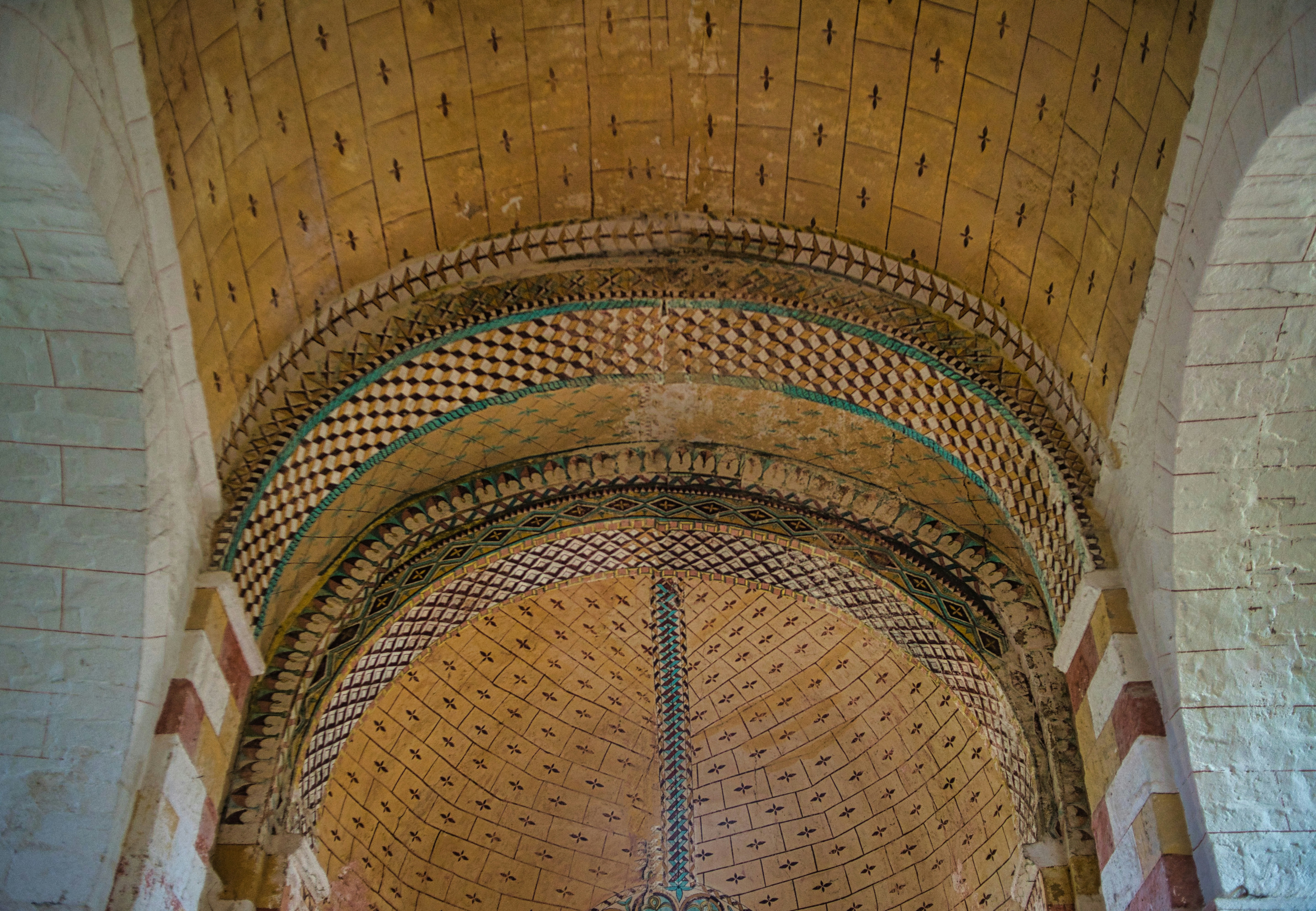 Ornate arched ceiling and walls with geometric patterns.