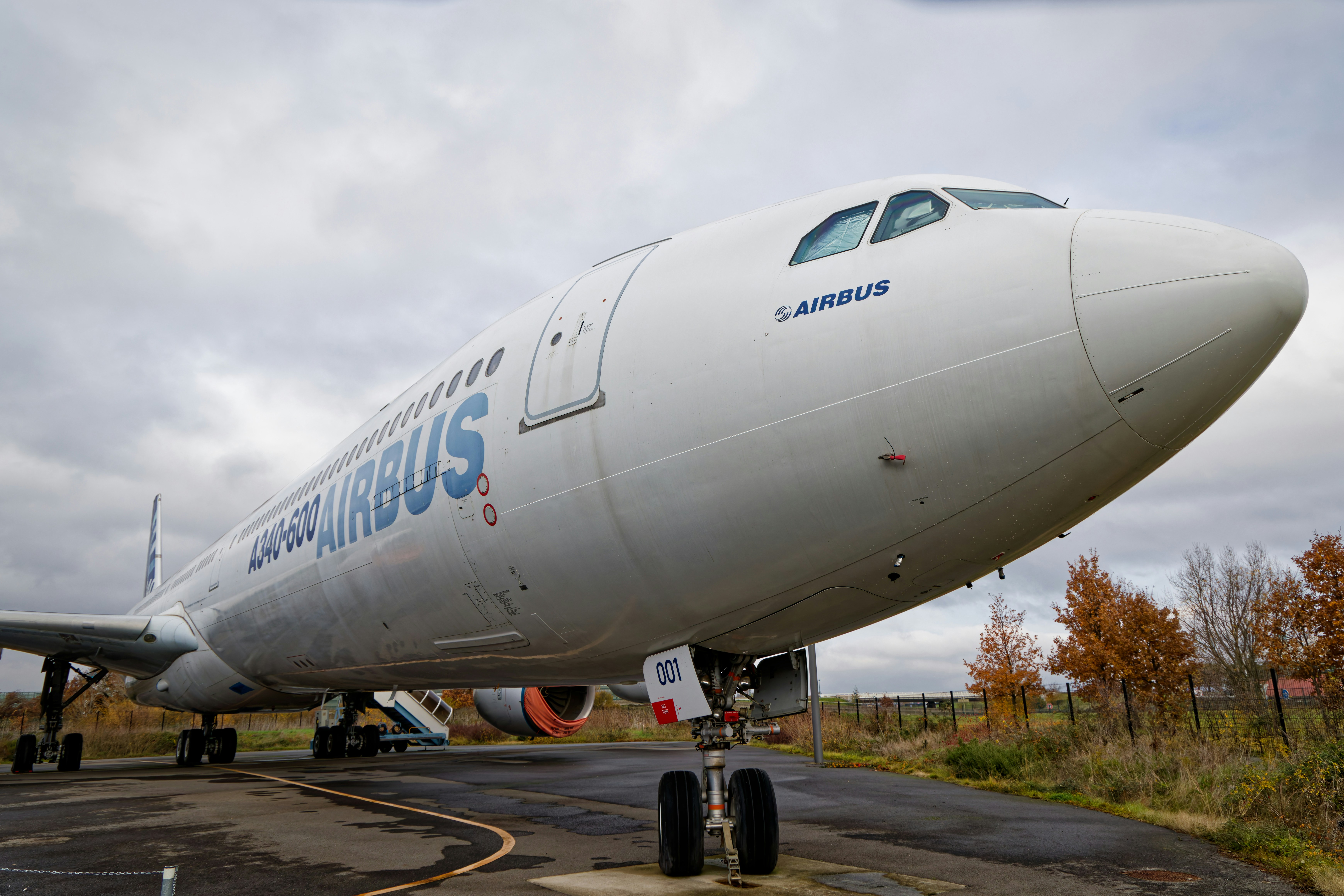 White airbus aircraft nose section parked outdoors