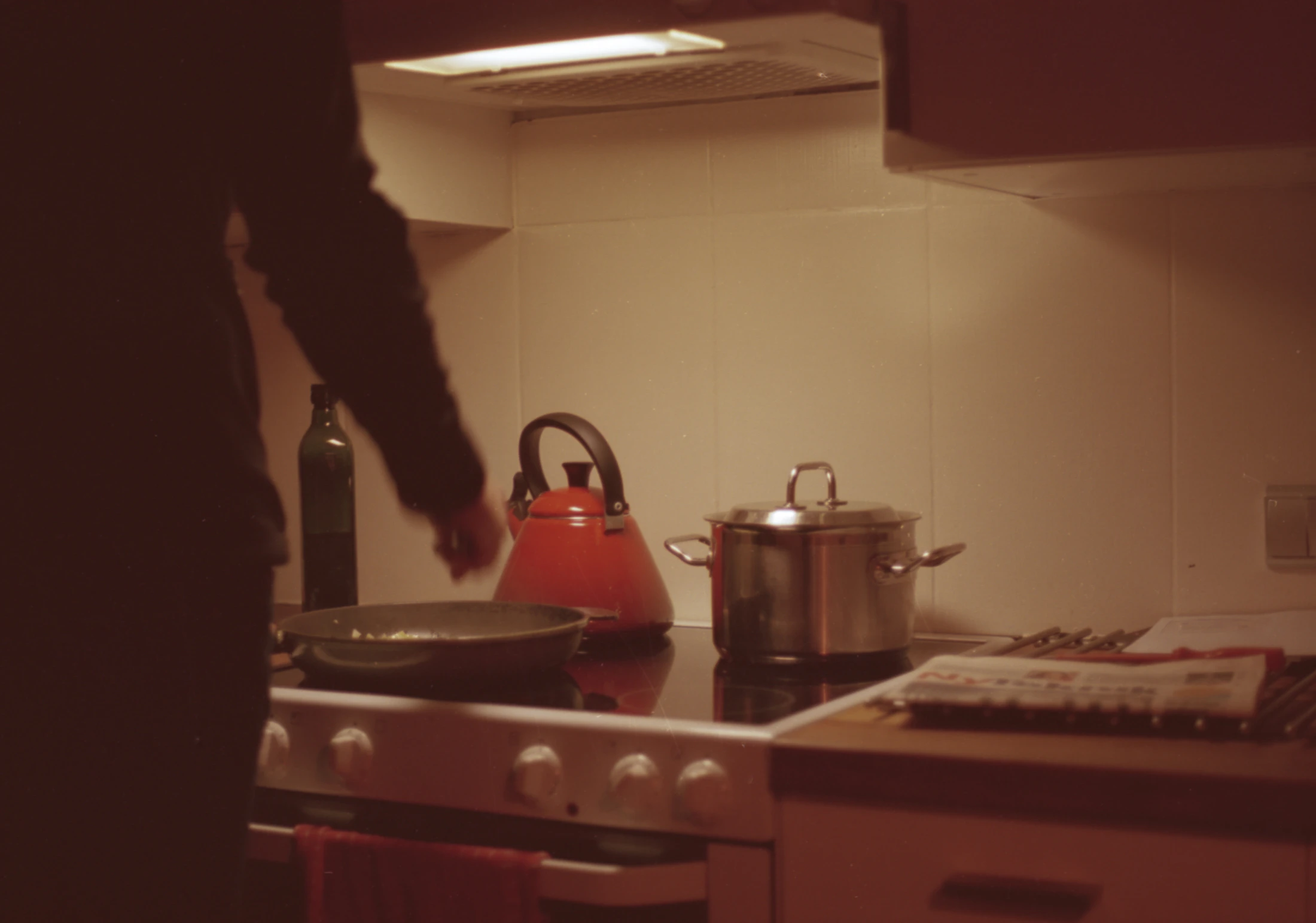 Cookware being used in a warm kitchen during meal preparation