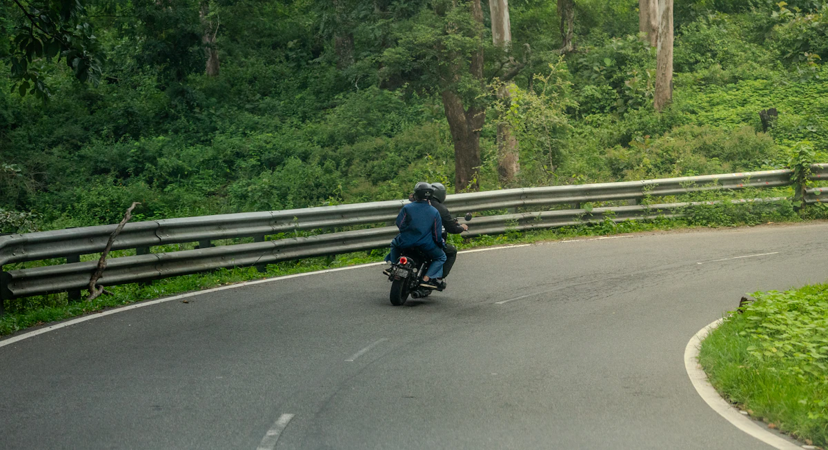 Rider on a winding forest road