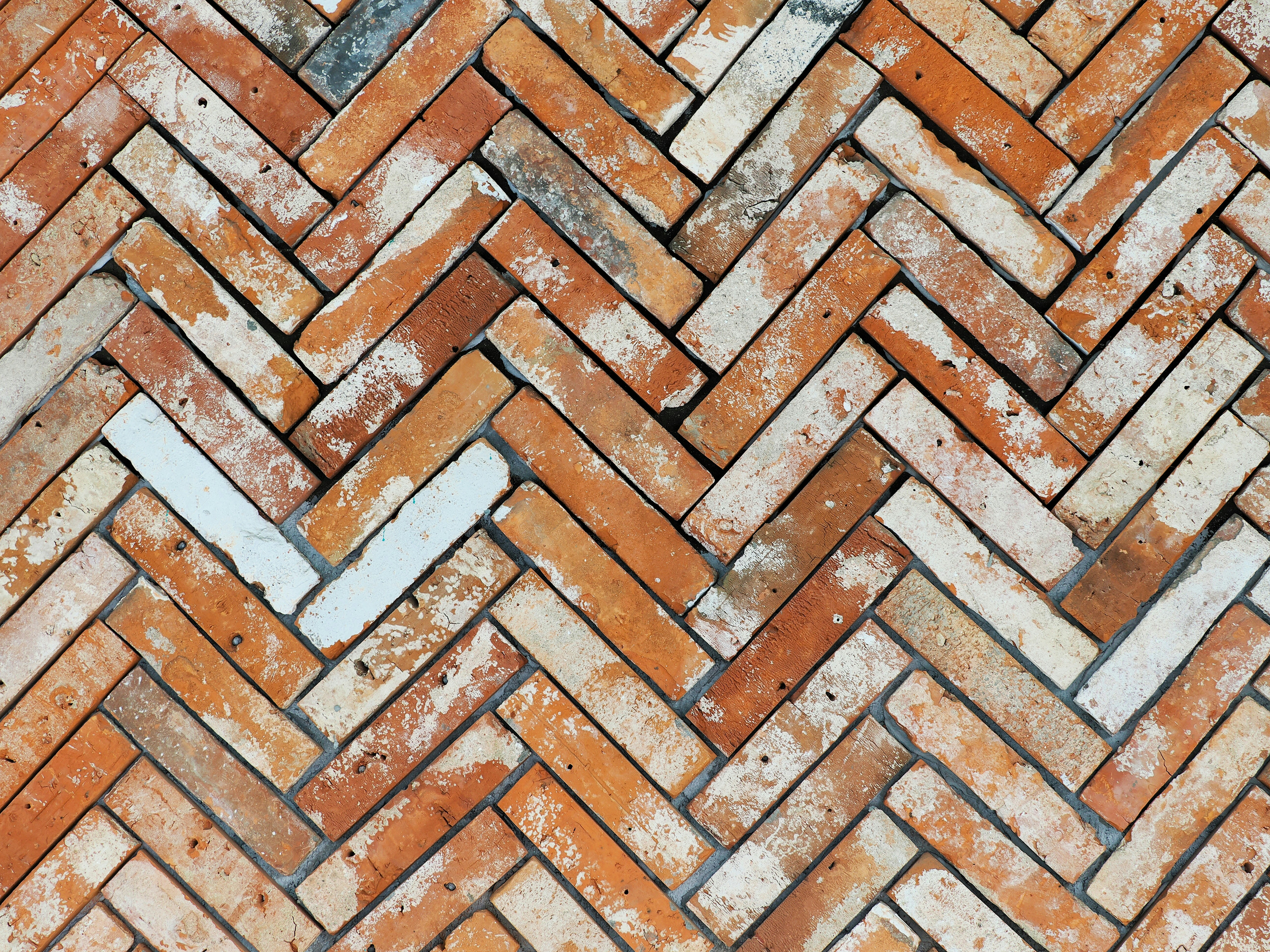 herringbone marble tile backsplash