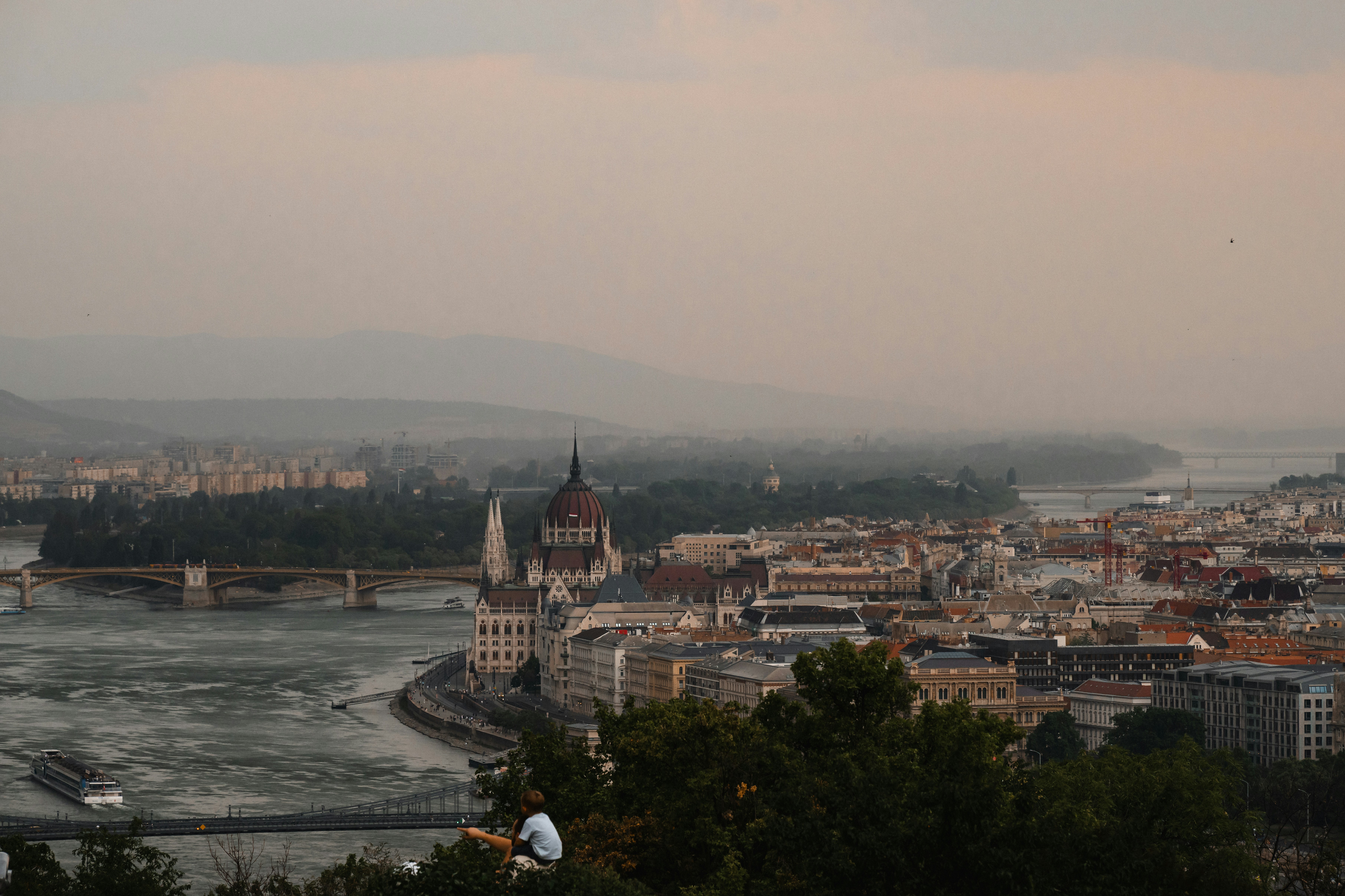 Hazy budapest cityscape with parliament building and danube river
