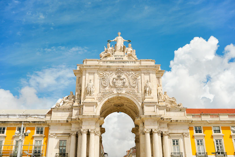 Majestic arco da rua augusta in lisbon under blue sky.