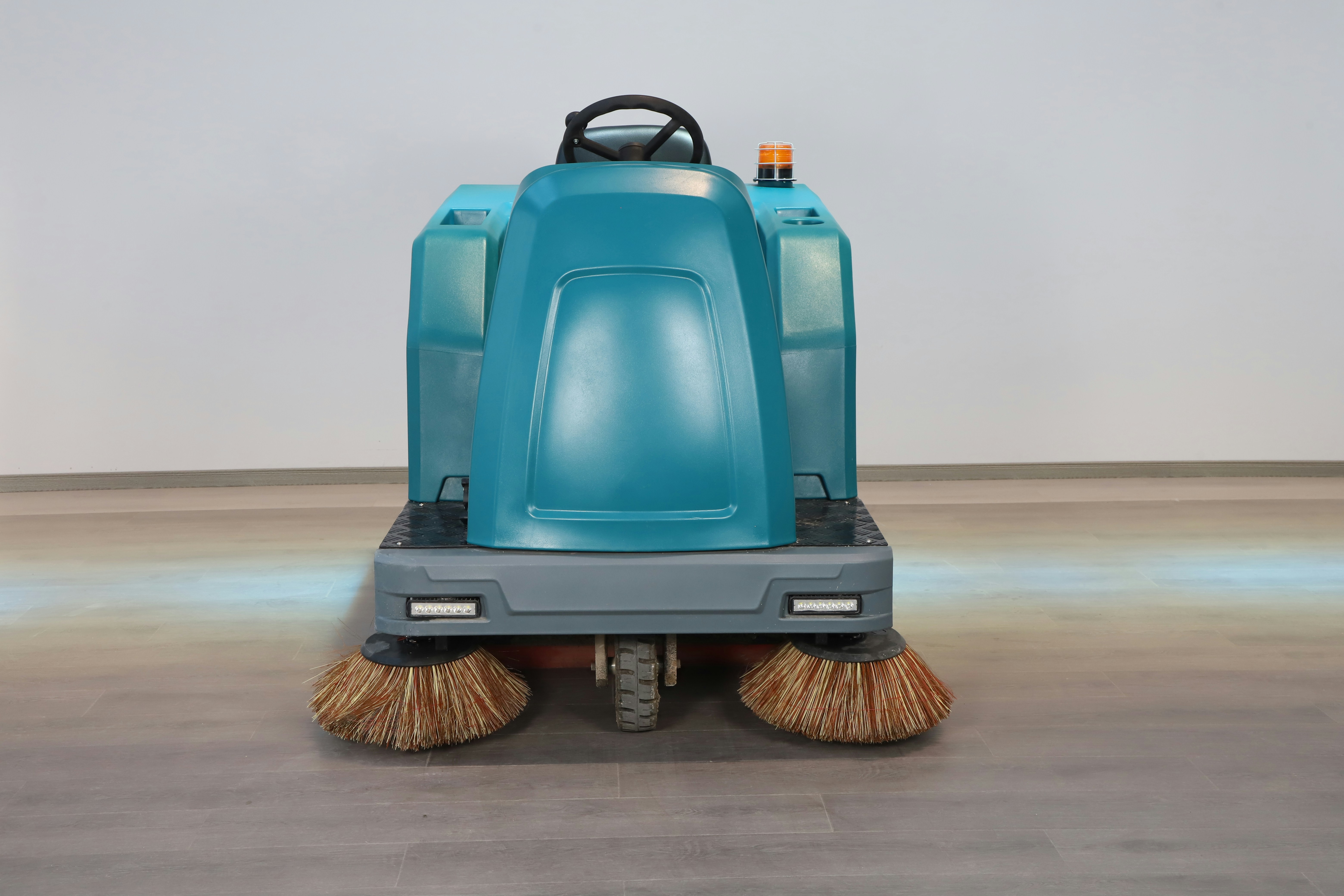 Industrial floor scrubber machine caring for commercial flooring