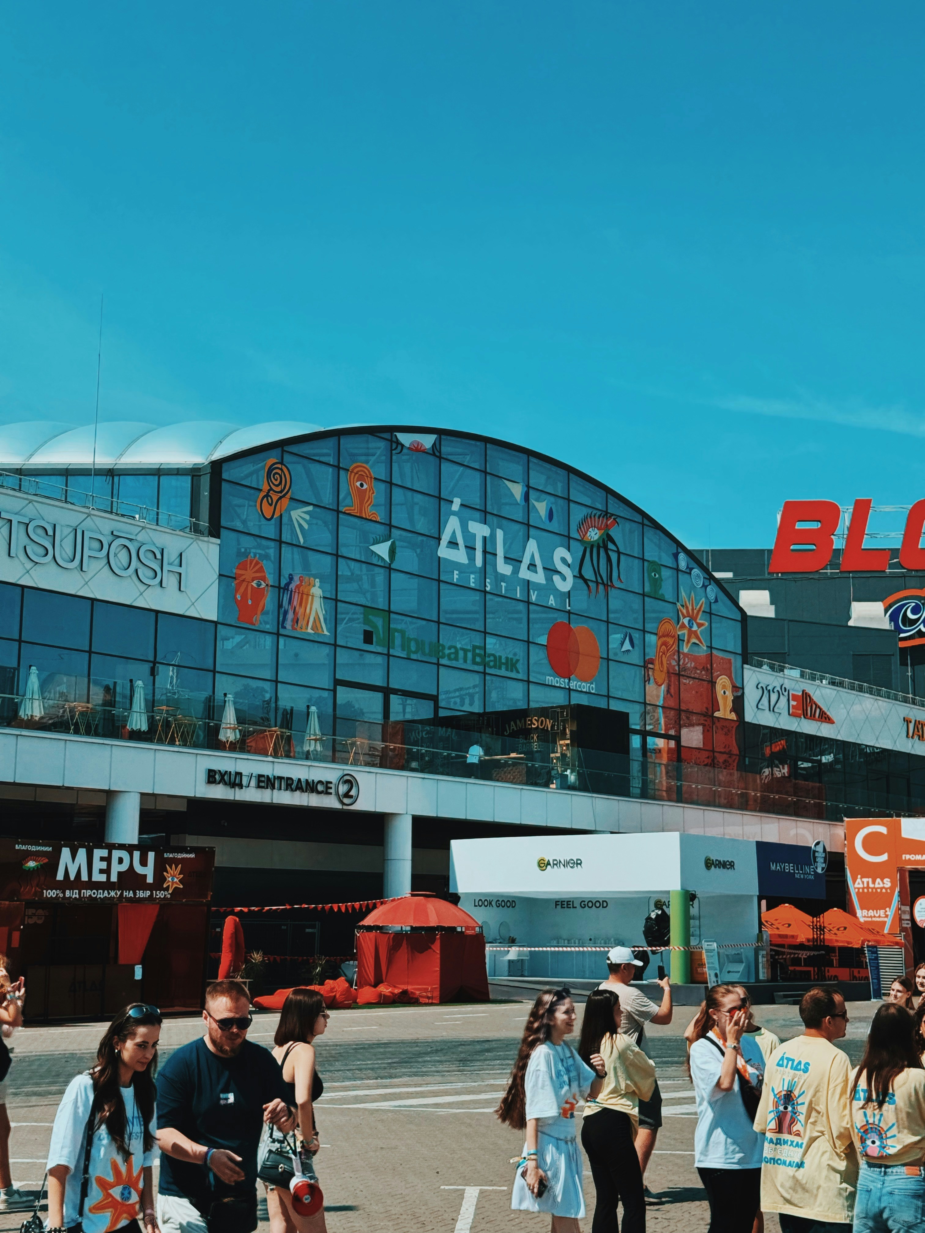 People gathered outside the modern atlas arena building.