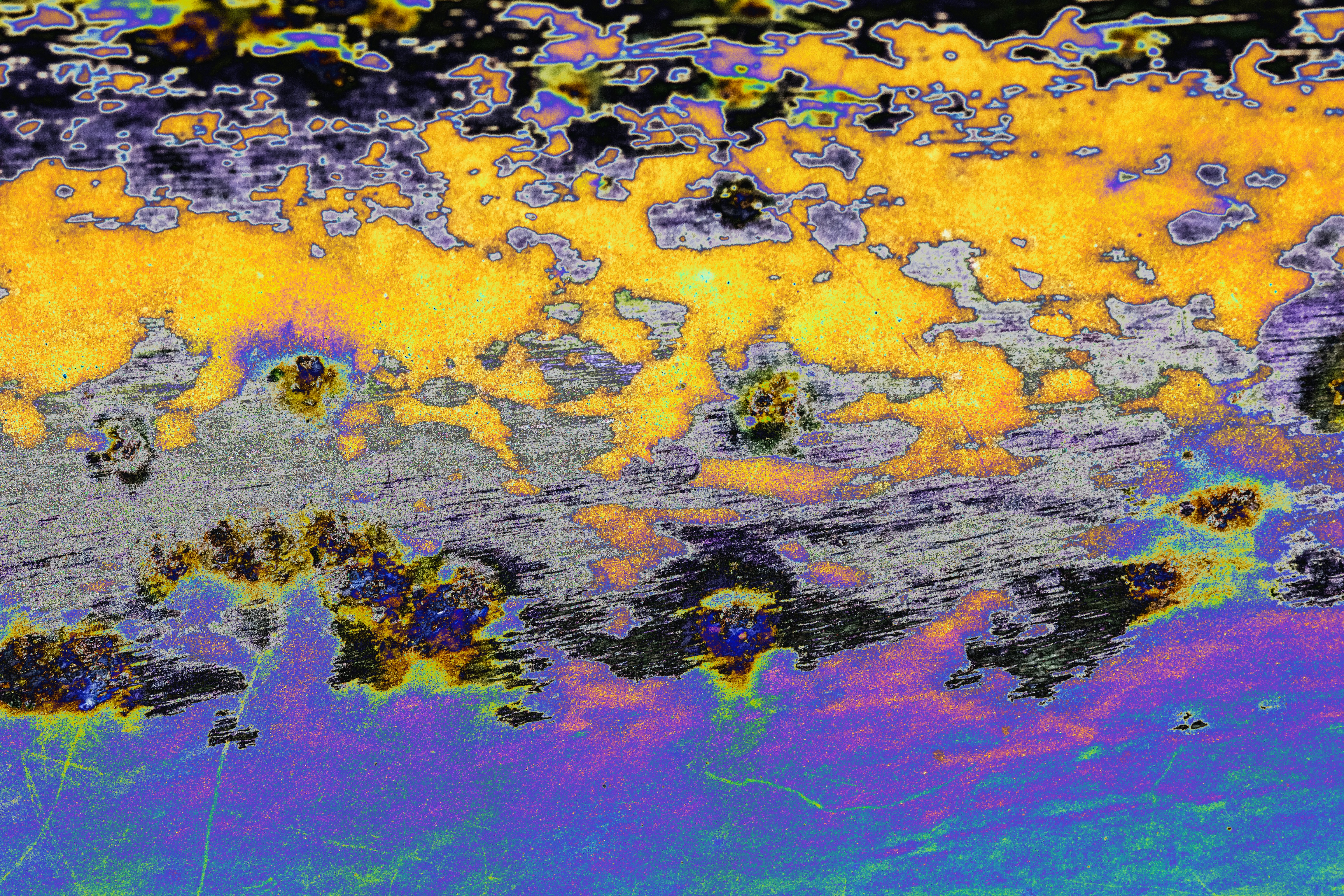 Abstract background with vibrant yellow, purple, and grey textures.