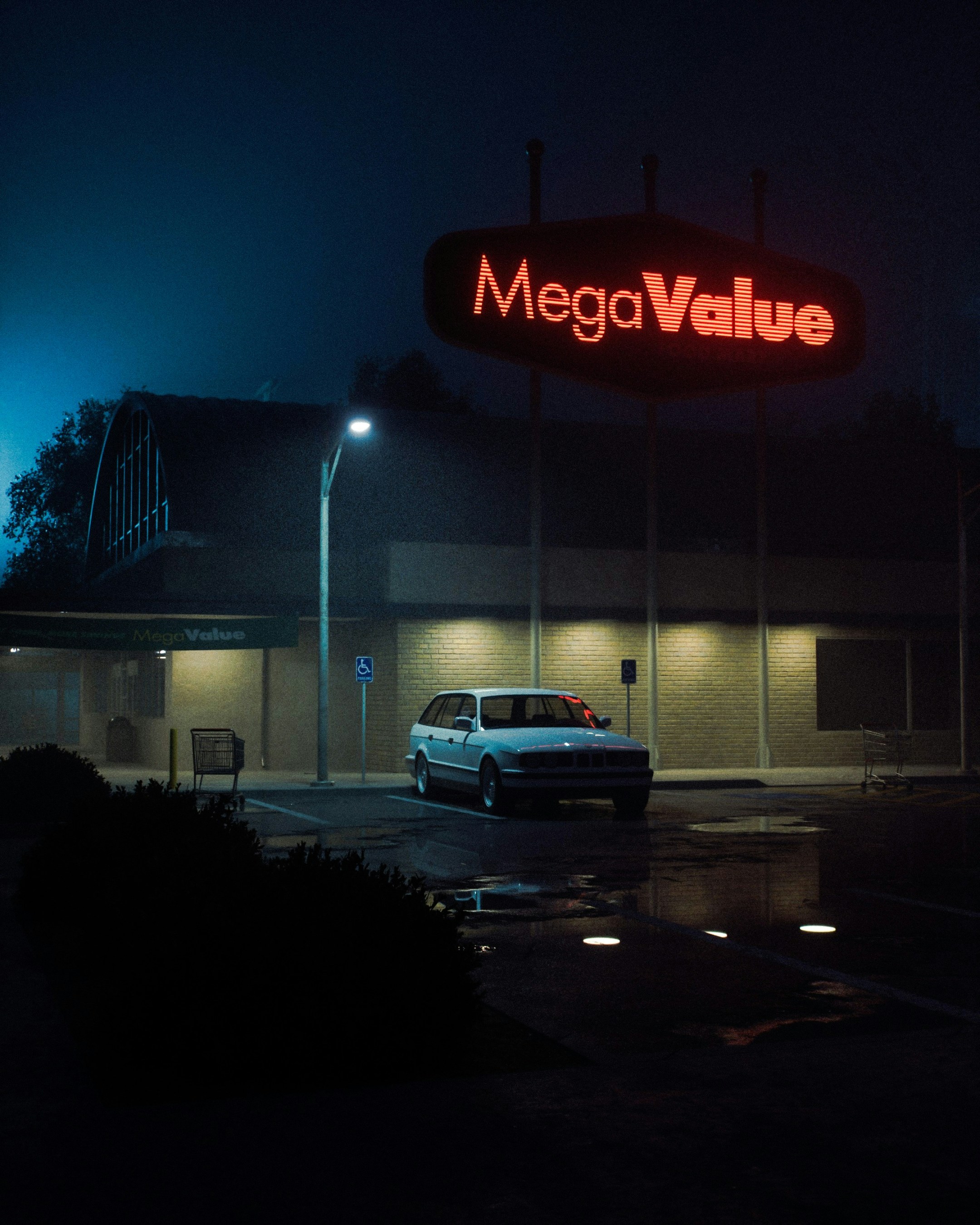 Megavalue store at midnight with parked car